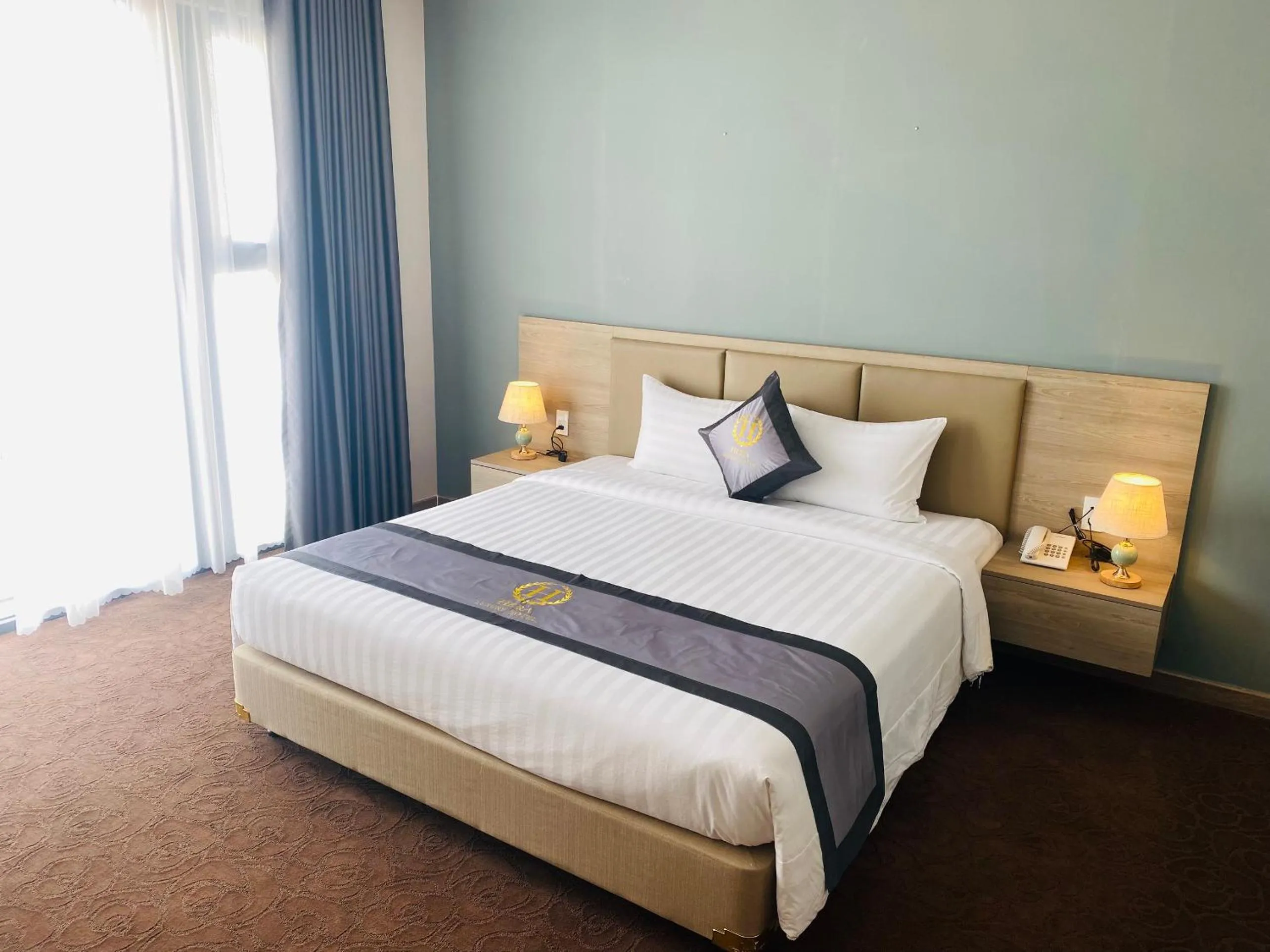 Bed in Hera Luxury Hotel