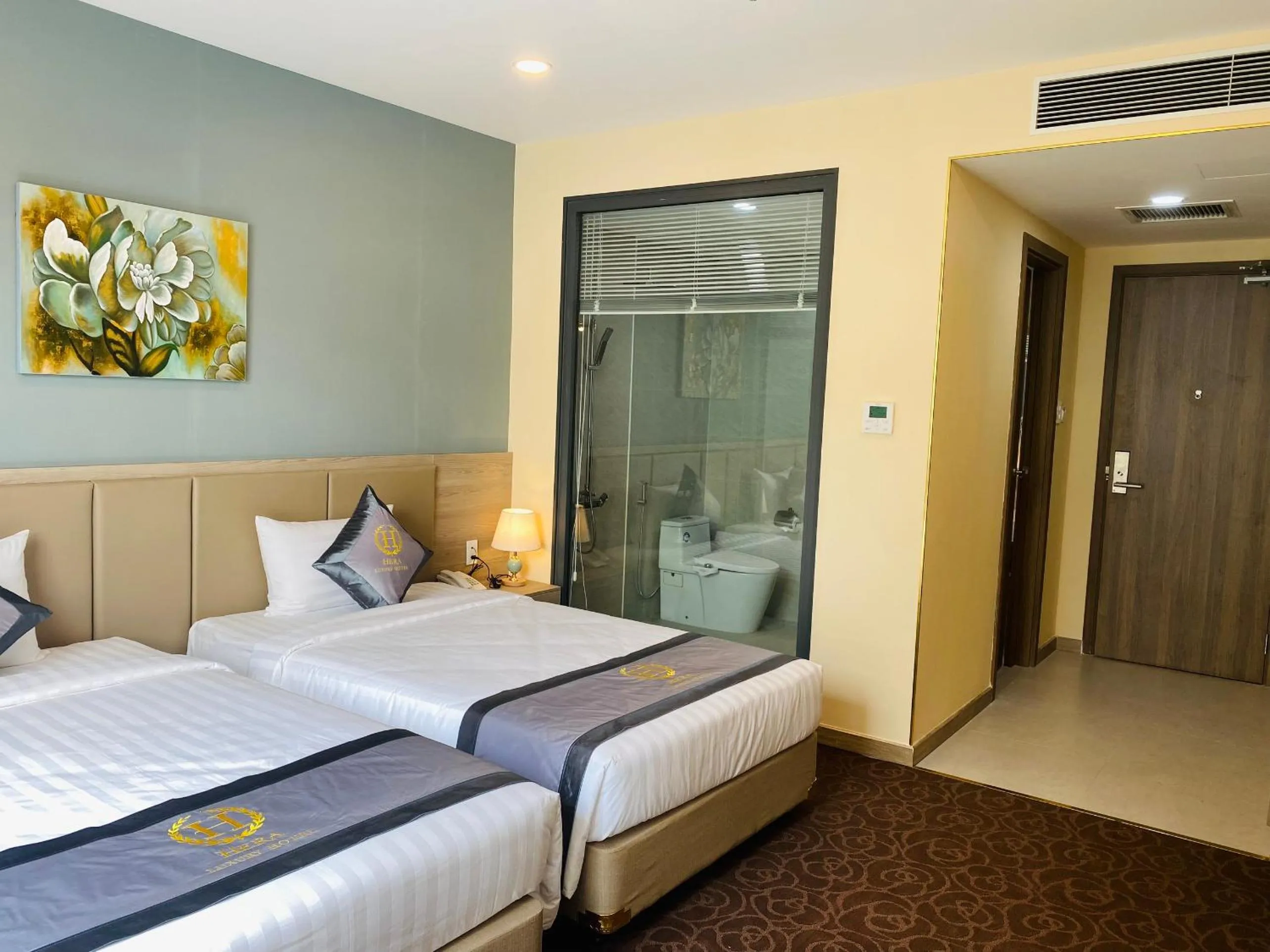 Bed in Hera Luxury Hotel