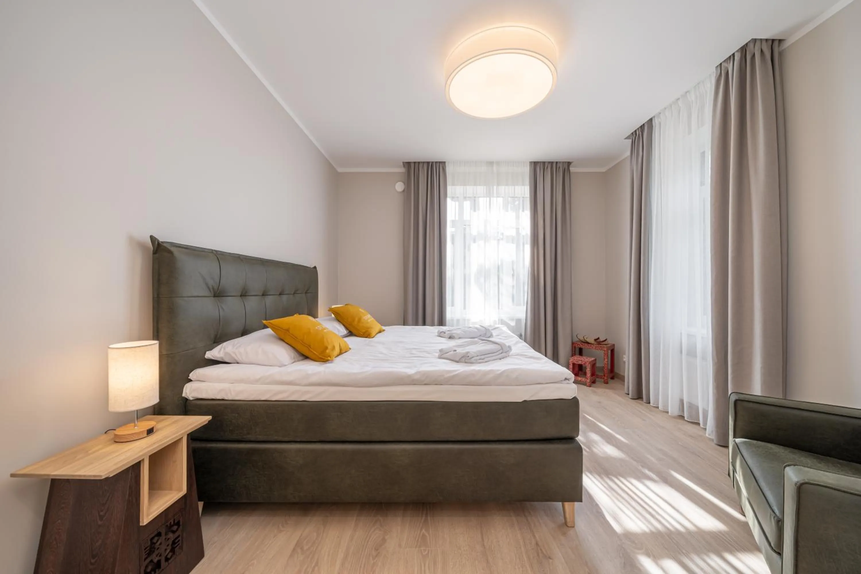 Bed in STORIES Design ApartHotel