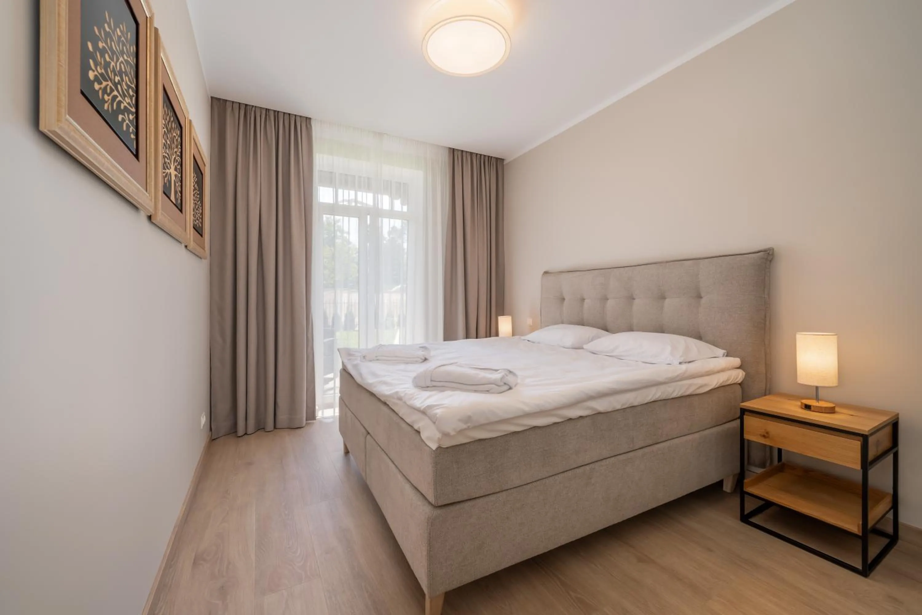 Bed in STORIES Design ApartHotel