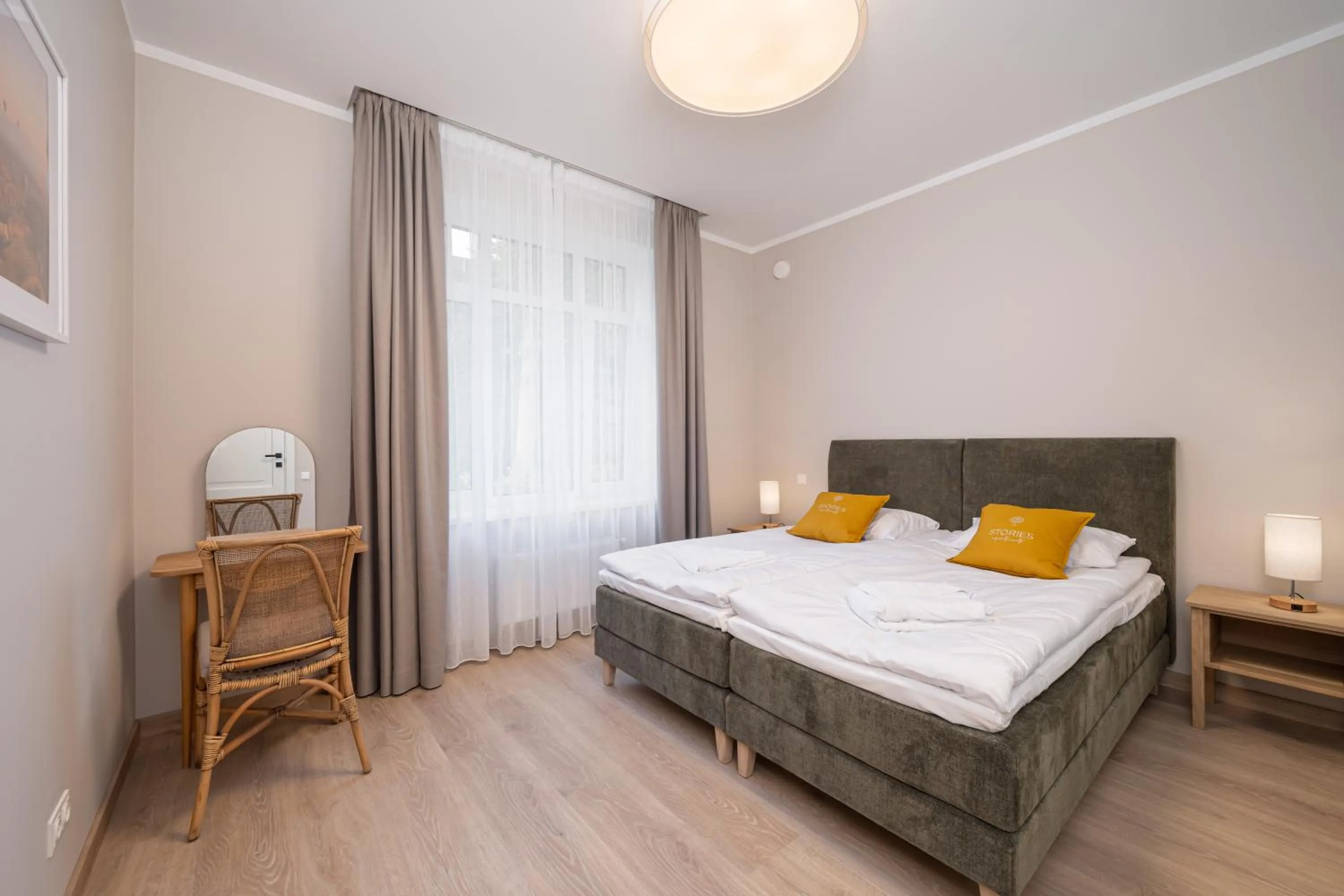 Bed in STORIES Design ApartHotel