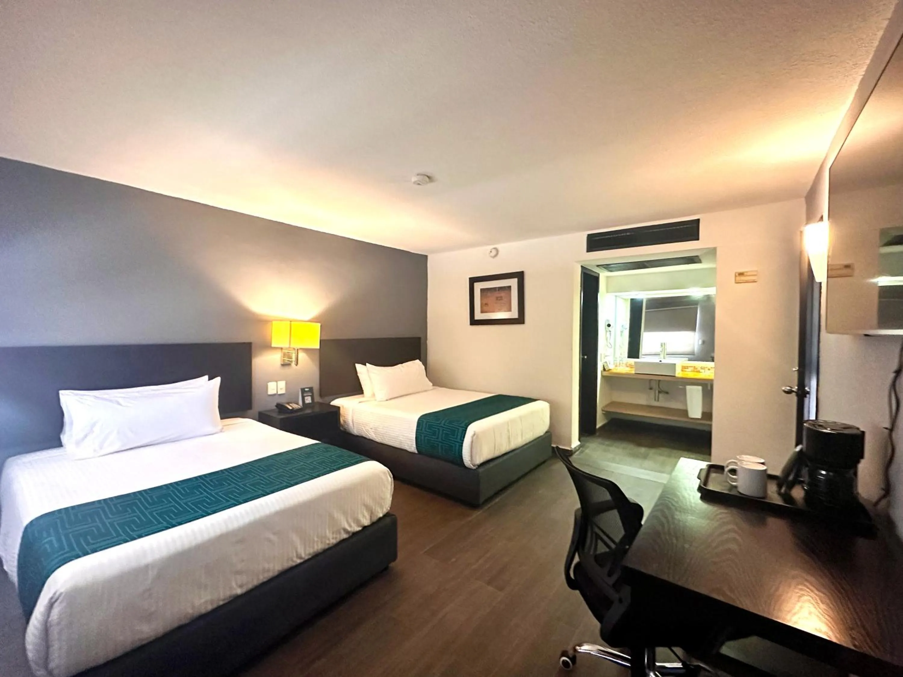 Bed in InHouse Hotel Obregón