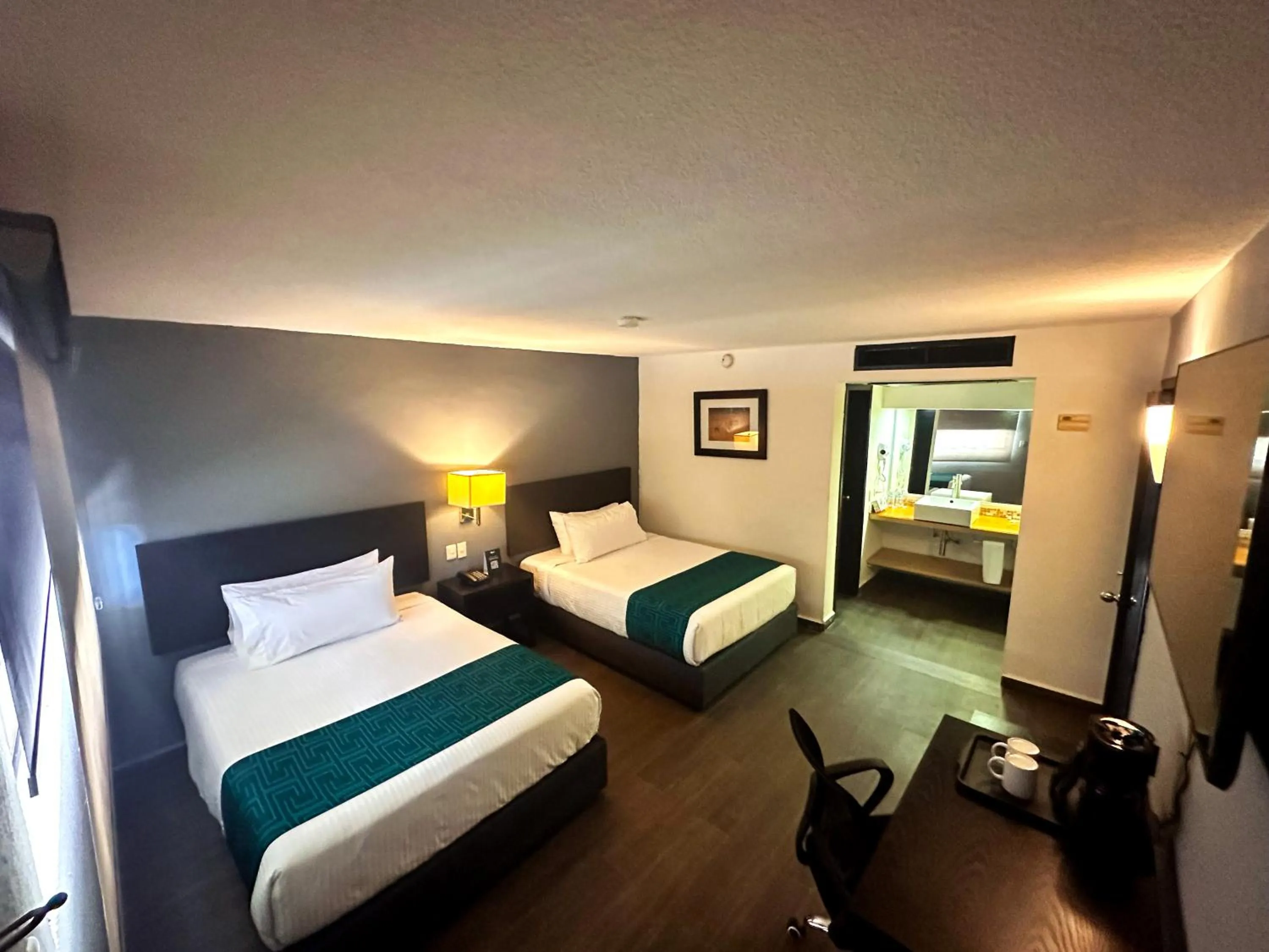 Bed in InHouse Hotel Obregón