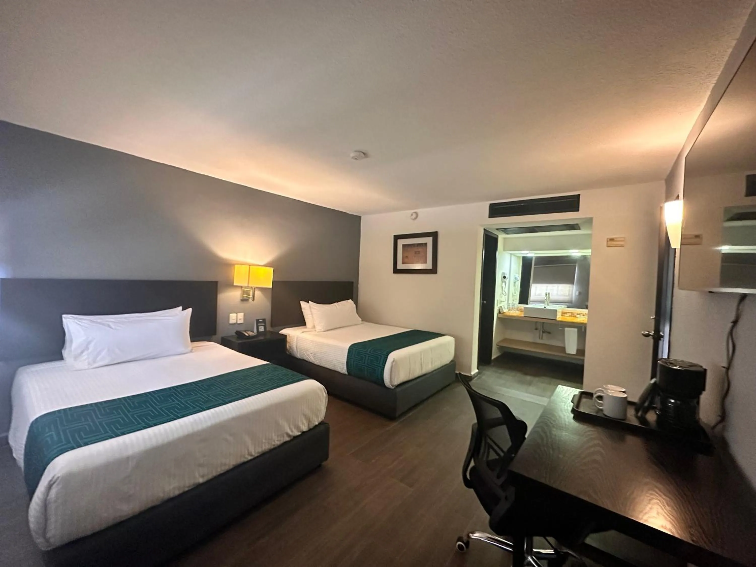 Bed in InHouse Hotel Obregón