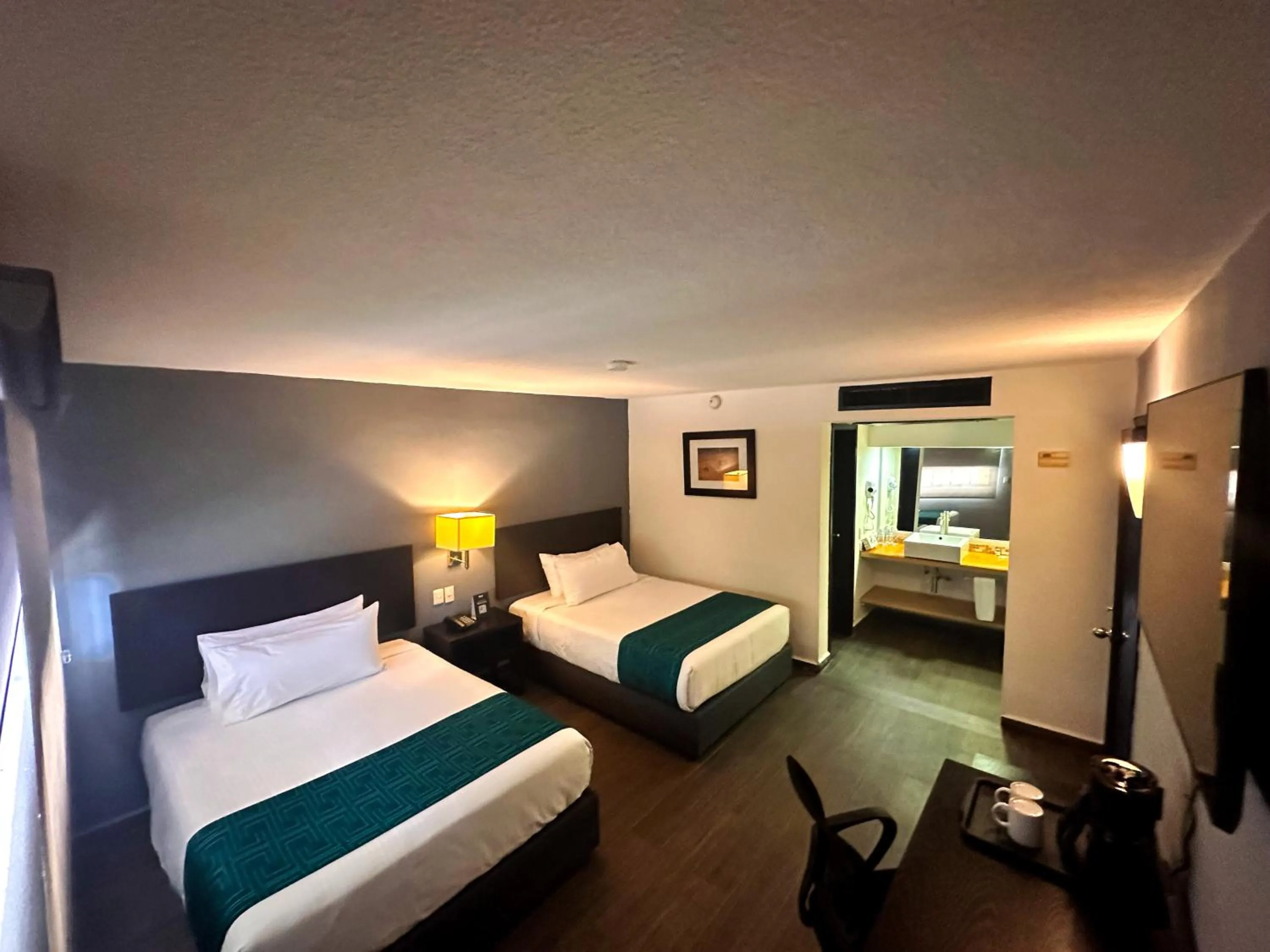 Bed in InHouse Hotel Obregón