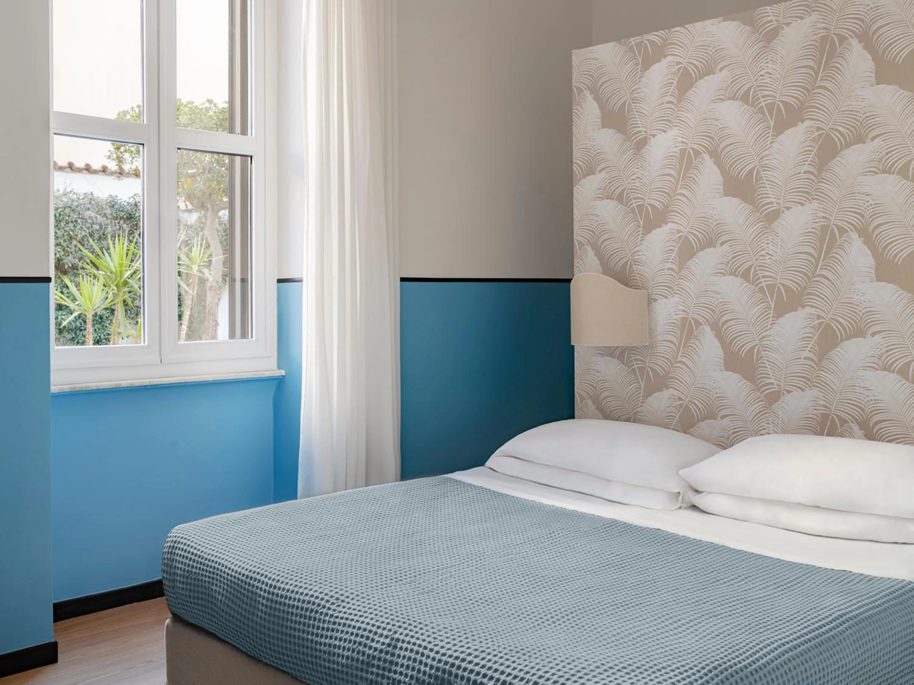 Bed in Hotel Riviera