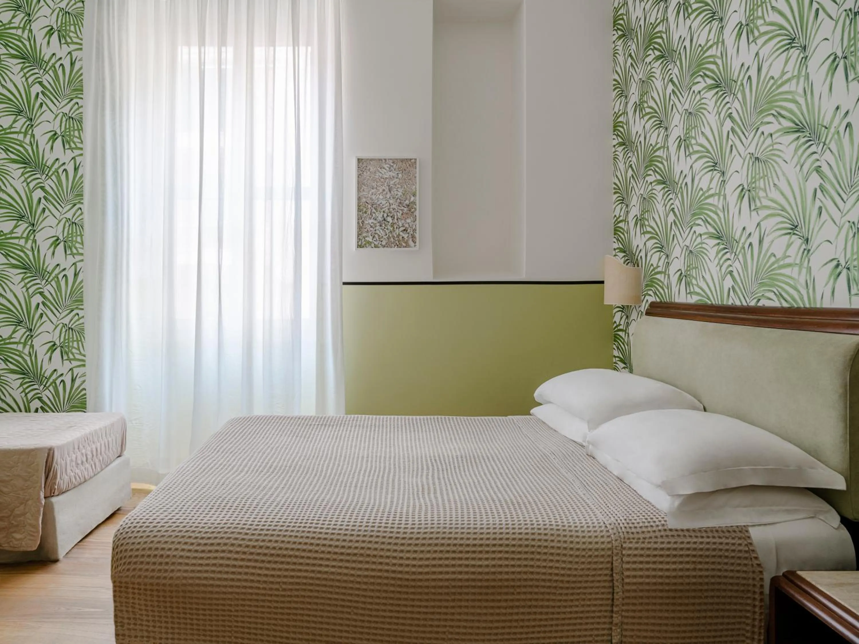 Bed in Hotel Riviera