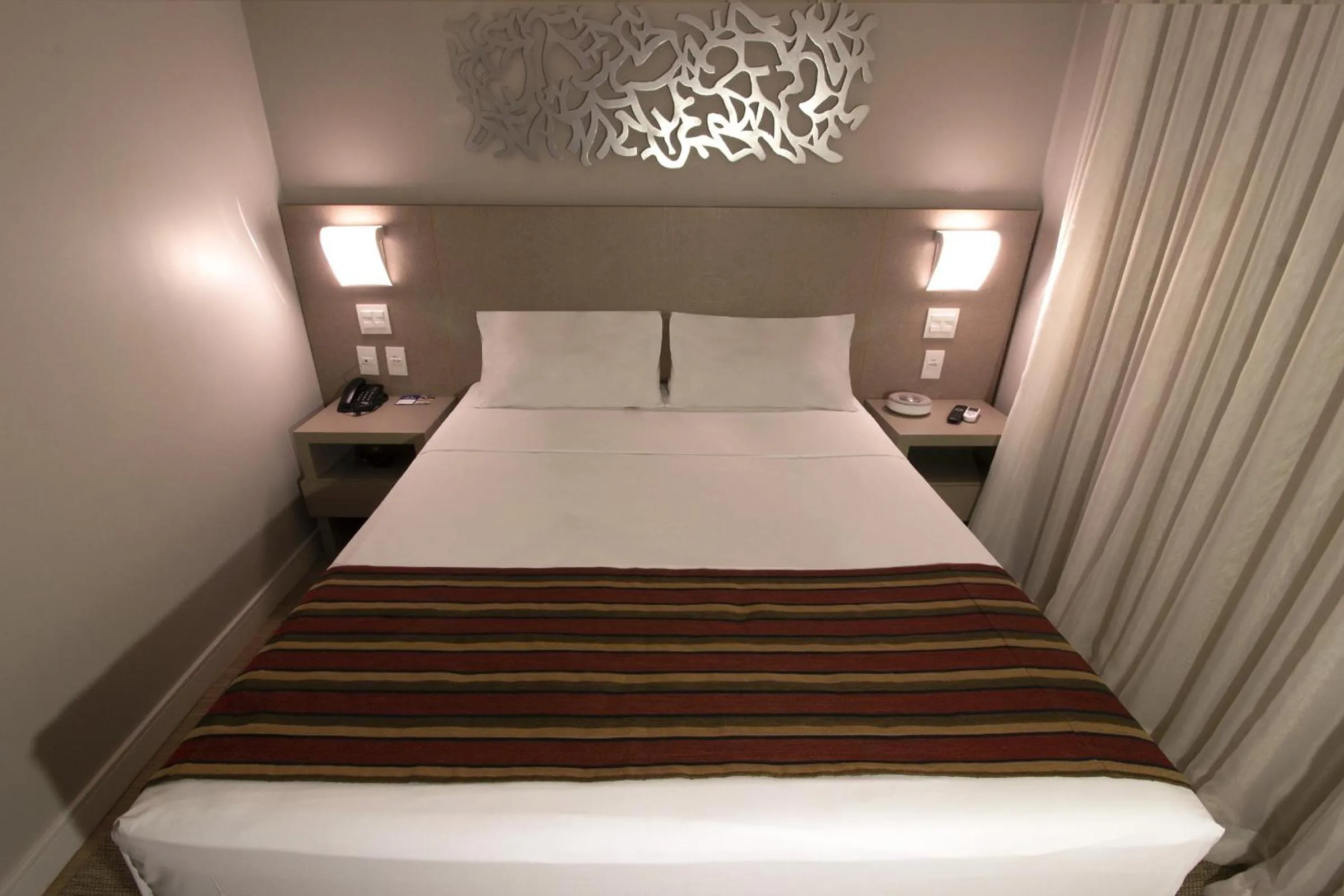 Photo of the whole room, Bed in Hotel Beaga Convention Expominas by MHB