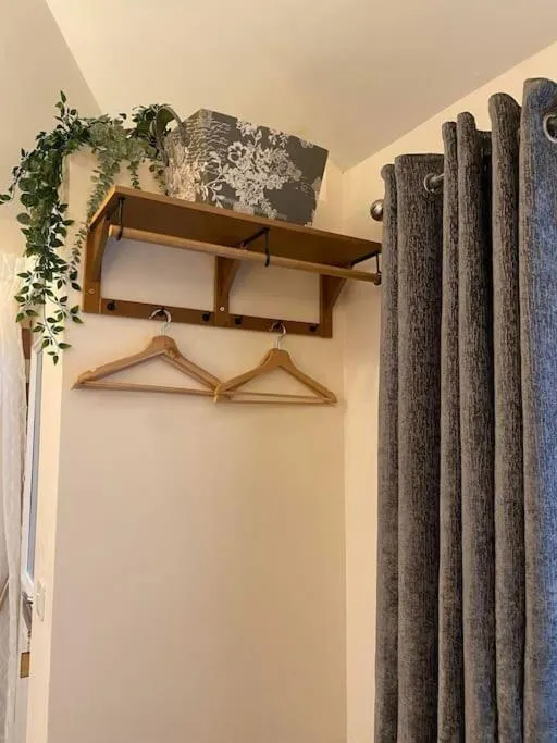 wardrobe in Cute Studio with kitchen, patio and free parking