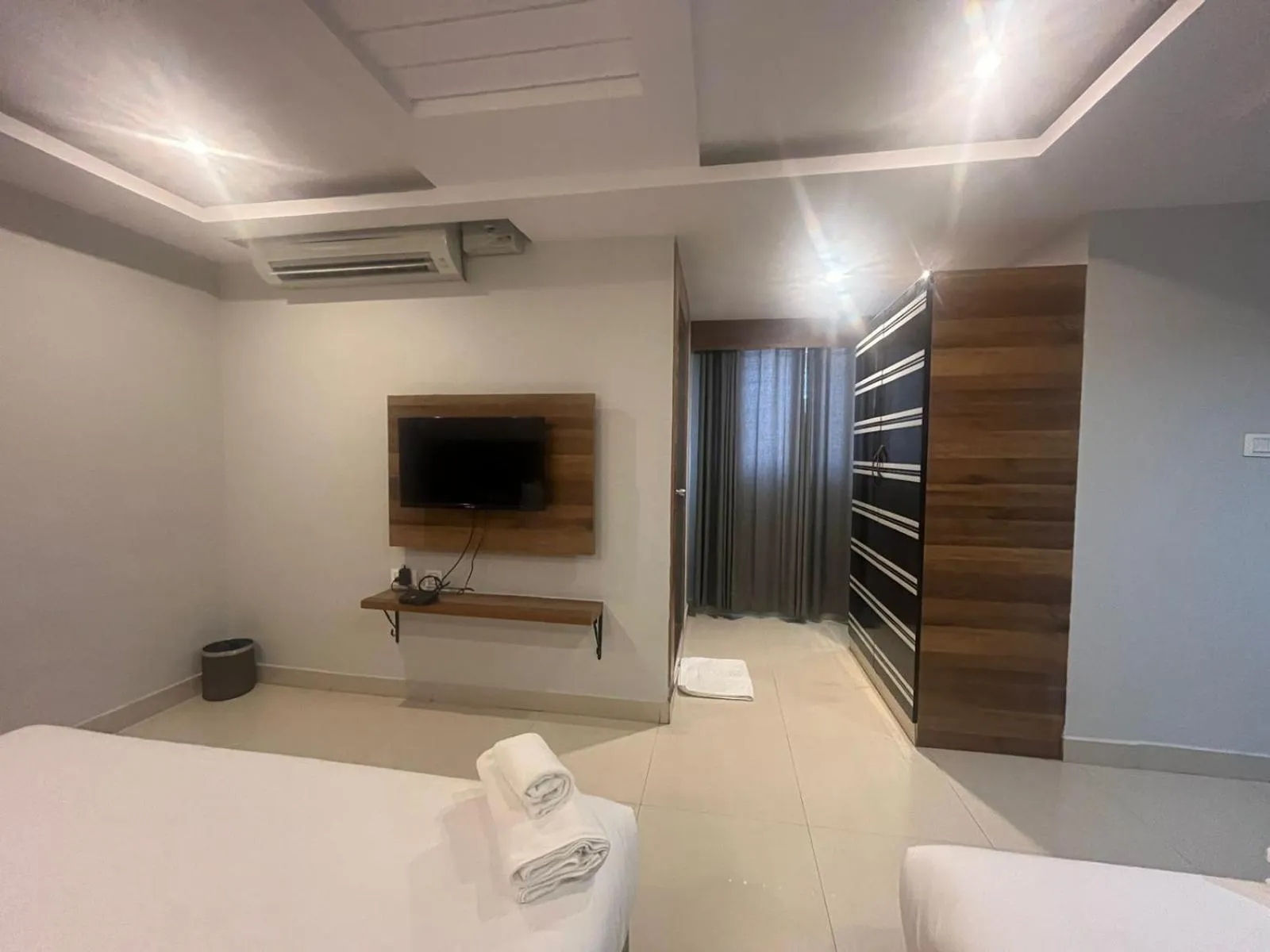 TV and multimedia, Bed in Hotel Avenue Suites Near International Airport Bangalore