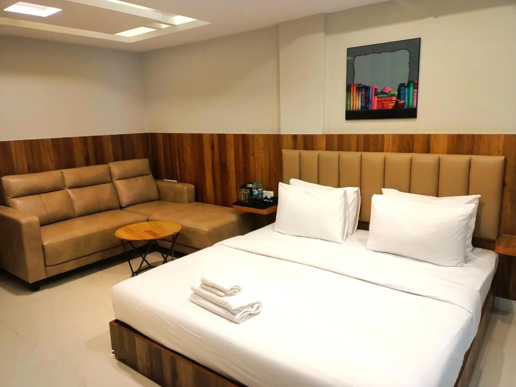 Seating area, Bed in Hotel Avenue Suites Near International Airport Bangalore