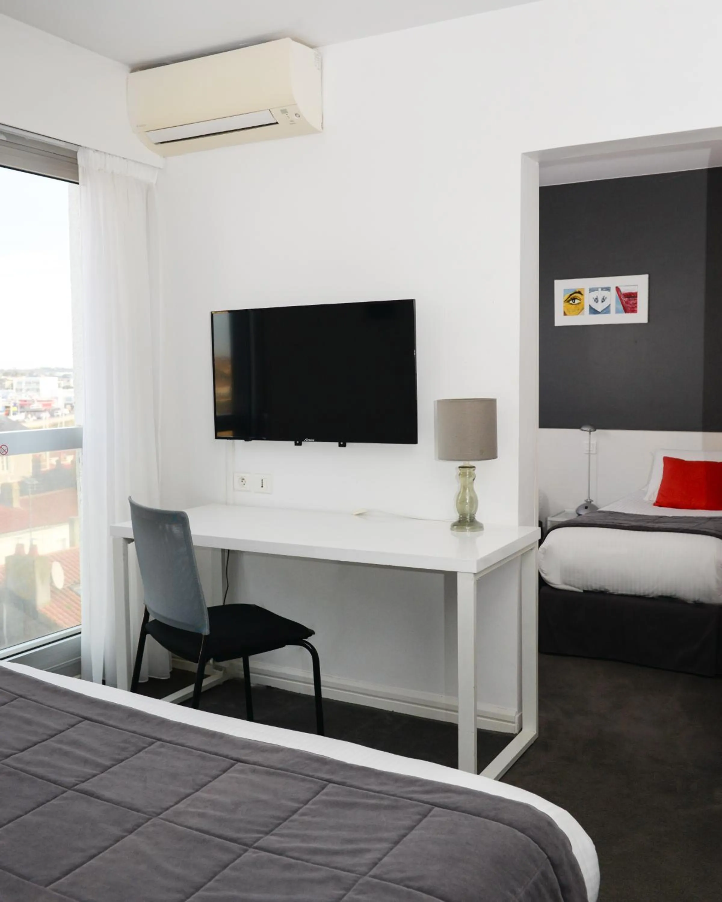 Seating area, Bed in Kyriad Prestige Les Sables d'Olonne - Plage - Centre des Congrès