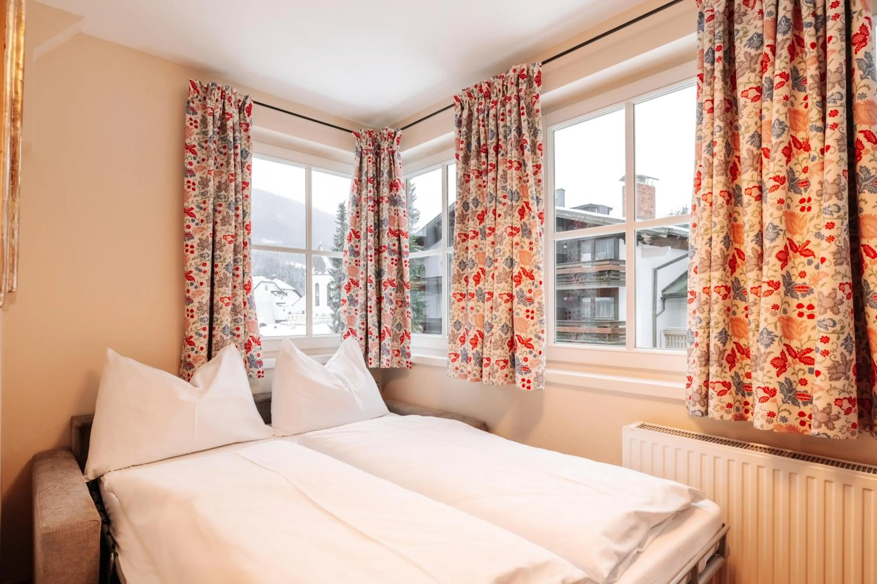 Seating area, Bed in Hubertus Boutiquehotel Filzmoos