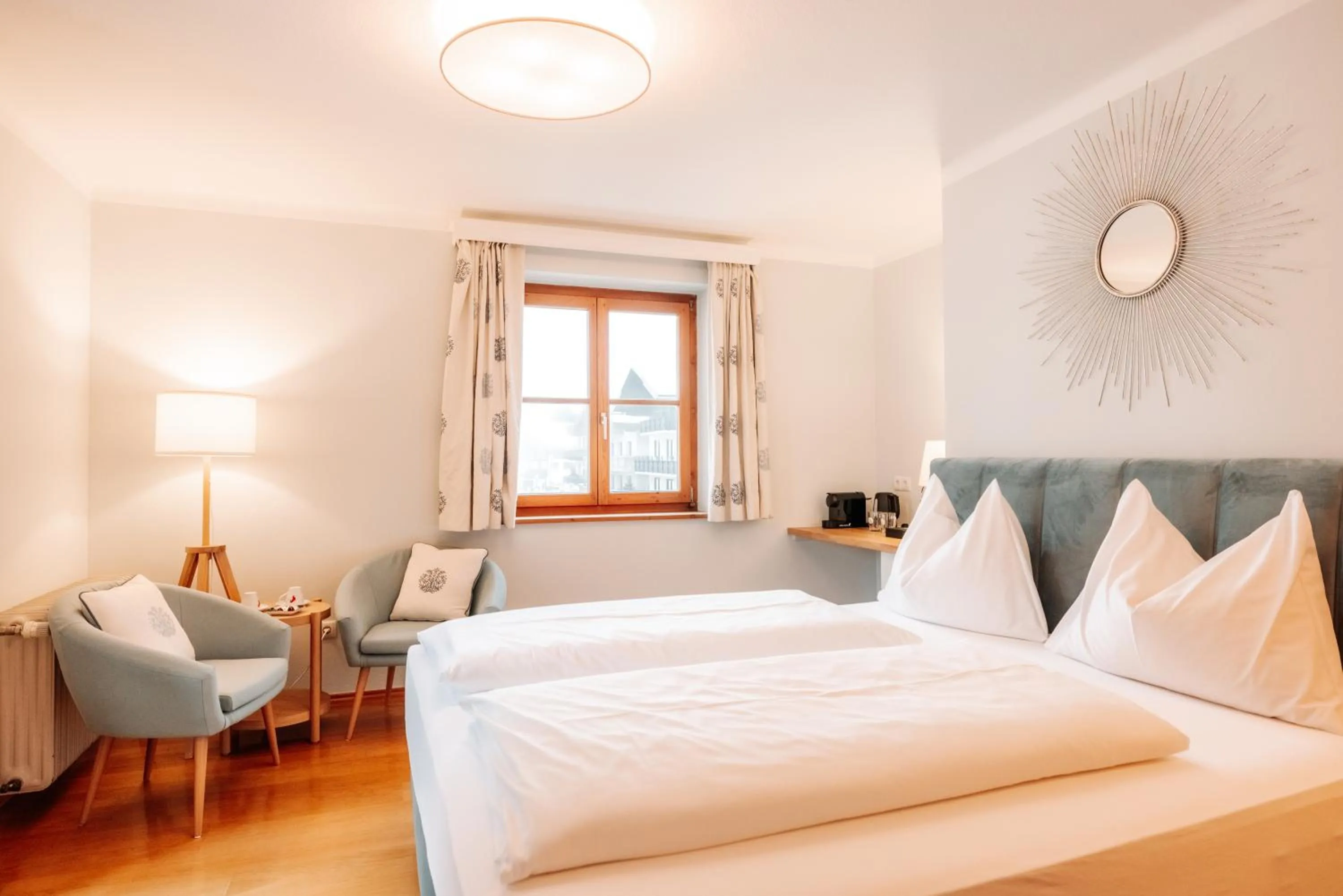 Seating area, Bed in Hubertus Boutiquehotel Filzmoos