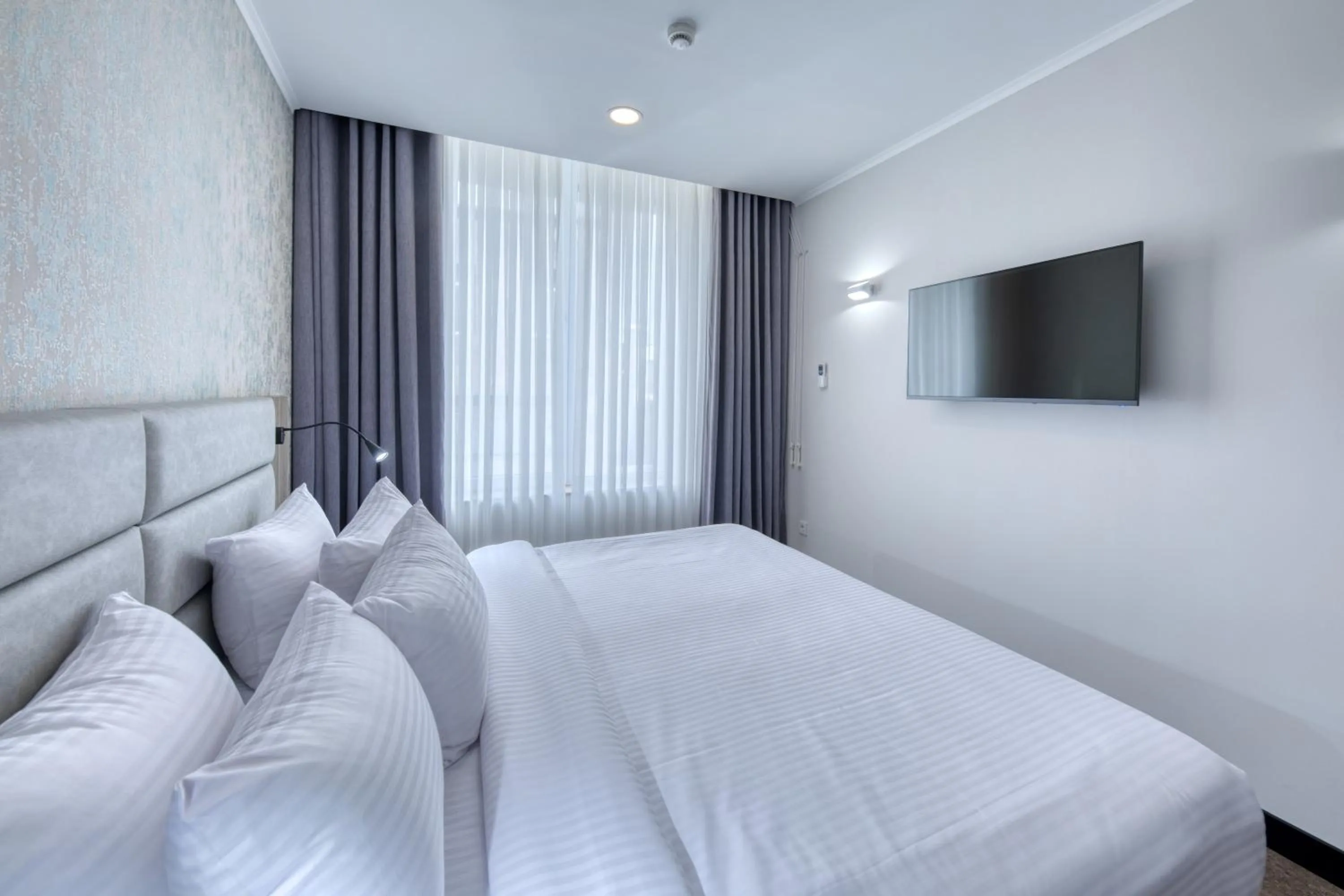 Bed in Expocore Hotel