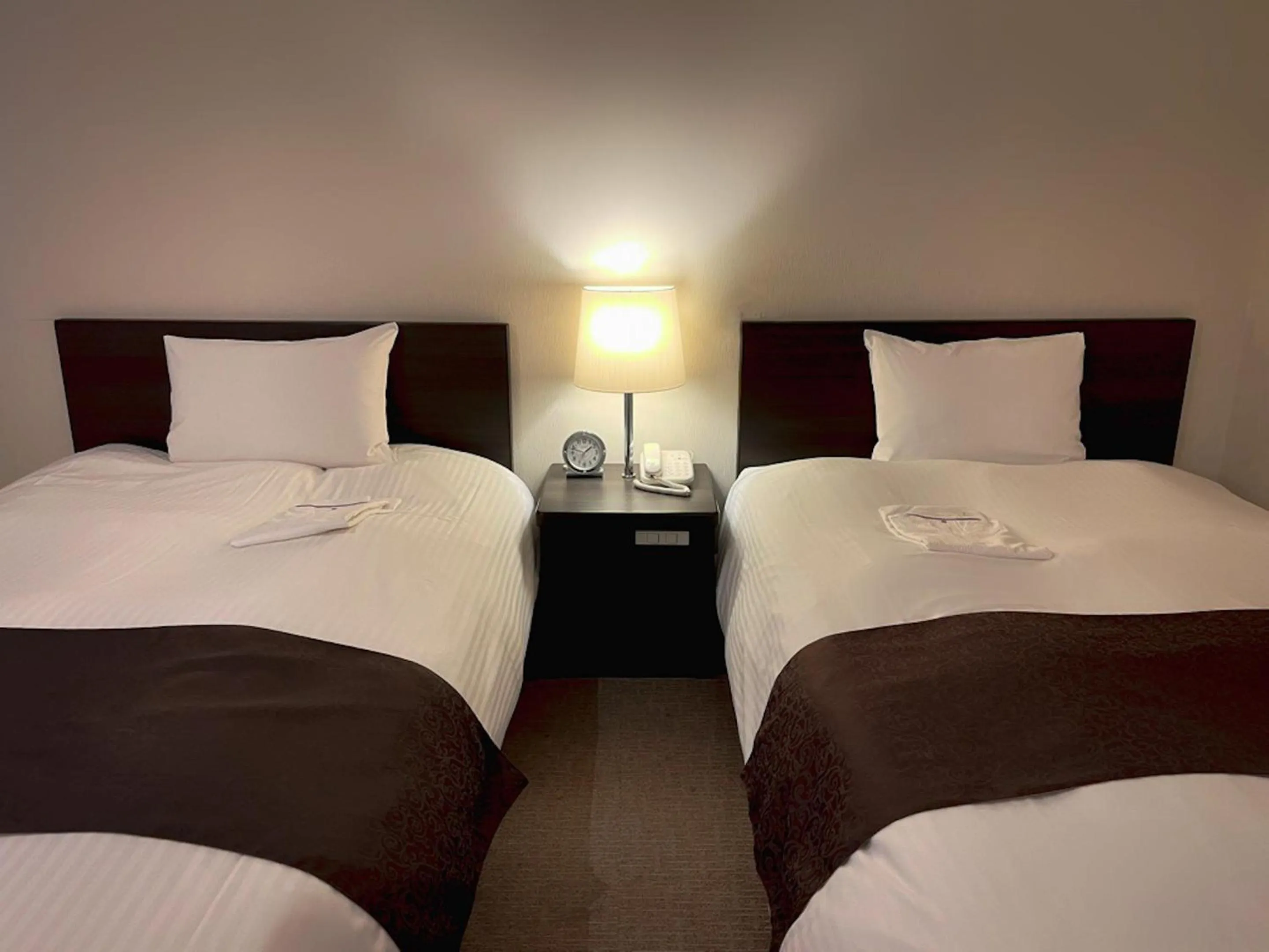 Bed in Shinjuku Sun Park Hotel