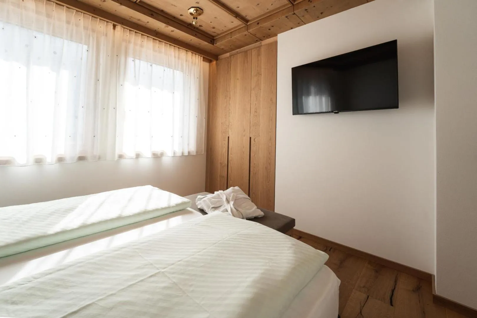 Bed in Aparthotel Zum Schlössl