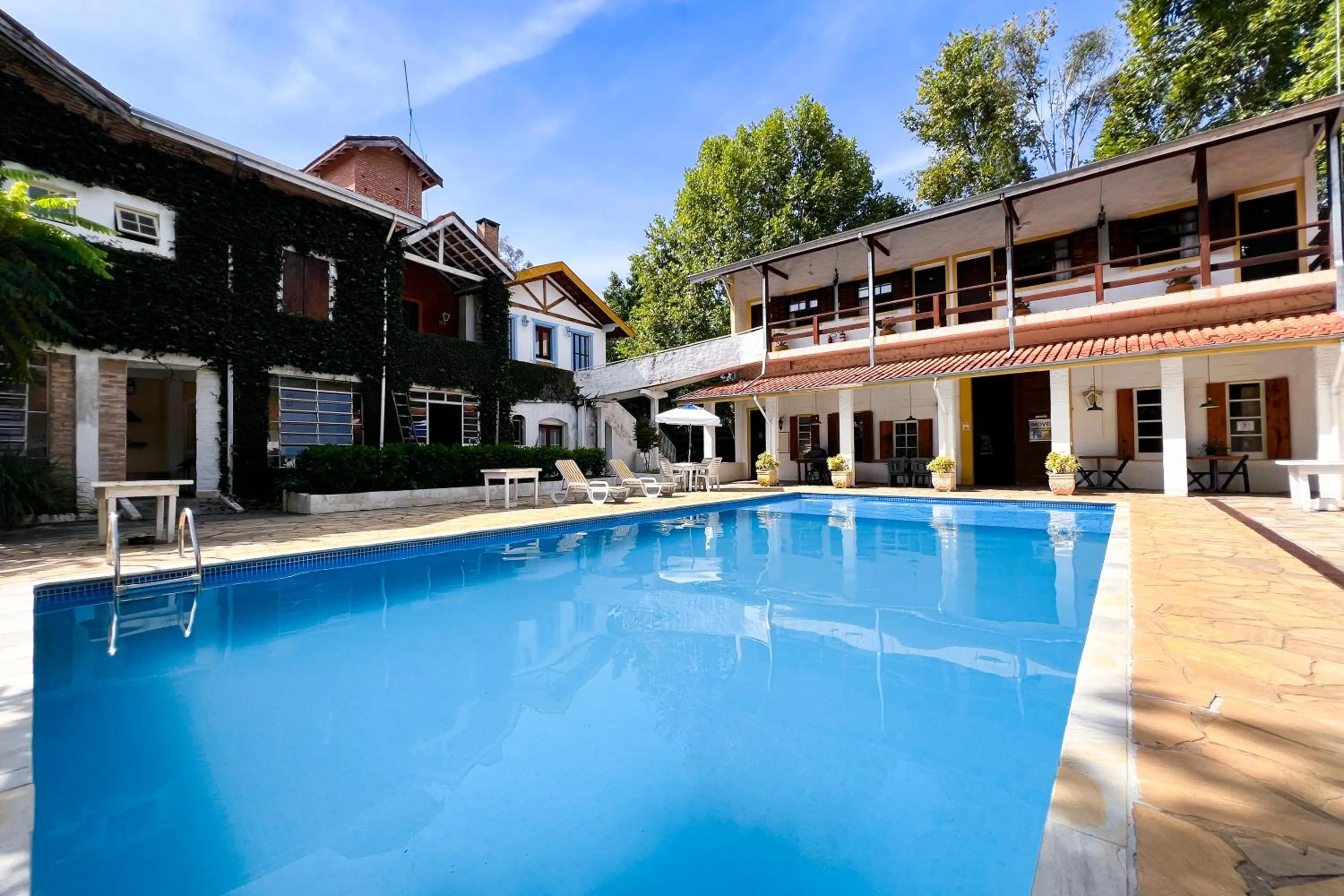 Swimming pool in VELINN Pousada Cesar