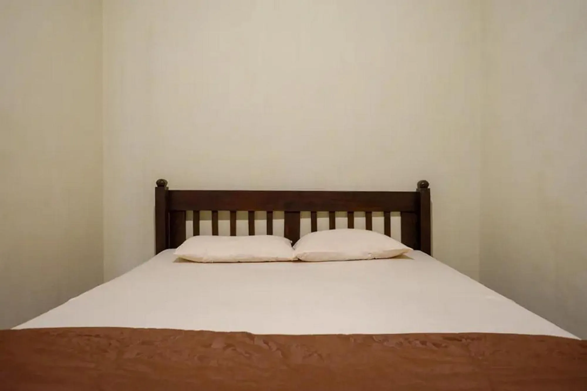 Bed in Cakra Homestay Solo Mitra RedDoorz