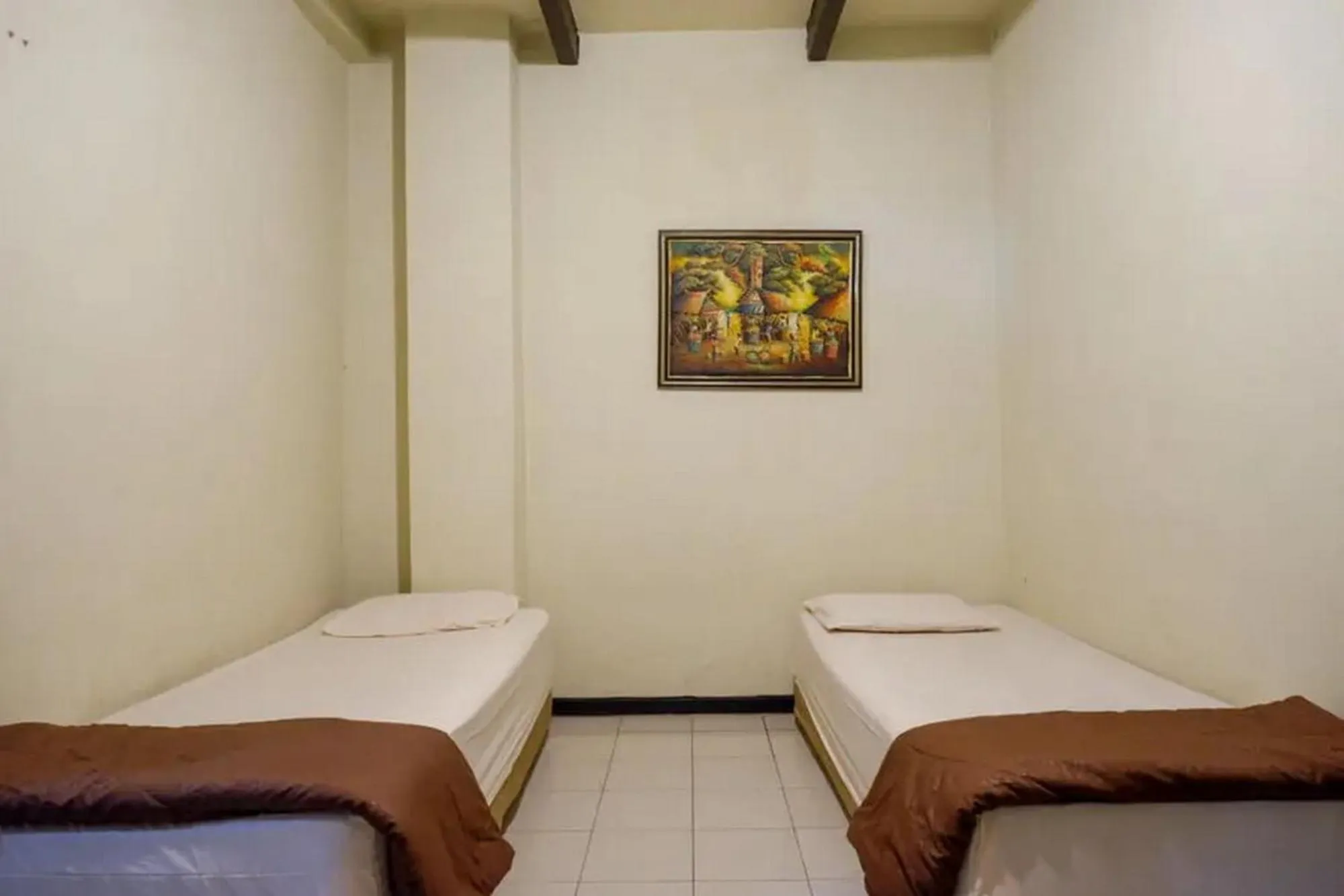 Bed in Cakra Homestay Solo Mitra RedDoorz