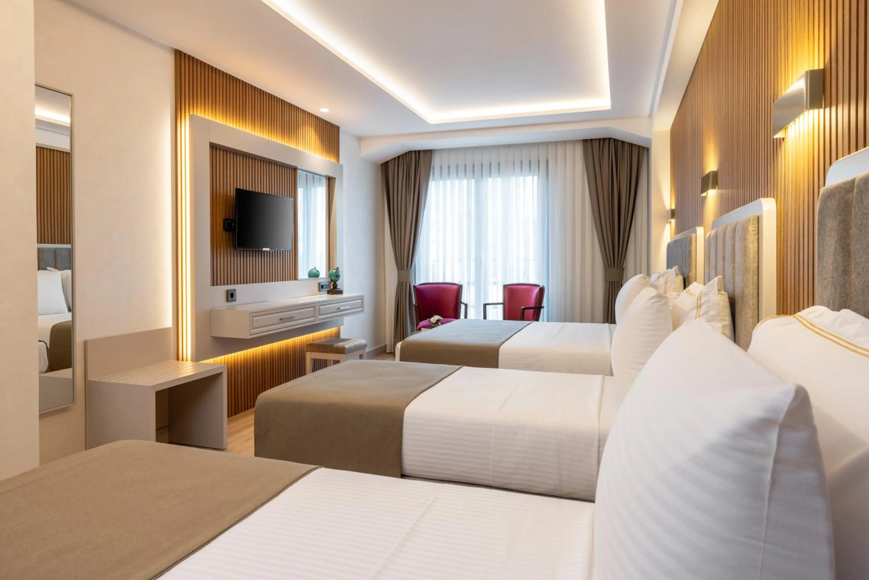 Bed in Carina Gold Hotel And Restaurant