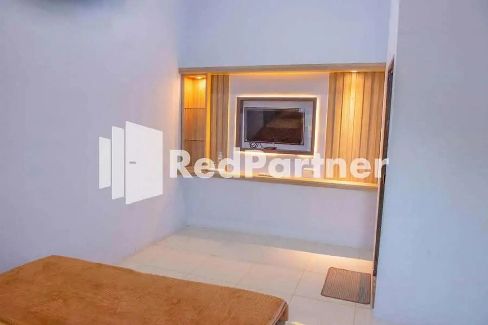 Bed in Hotel Rai's Palopo Exclusive Mitra RedDoorz