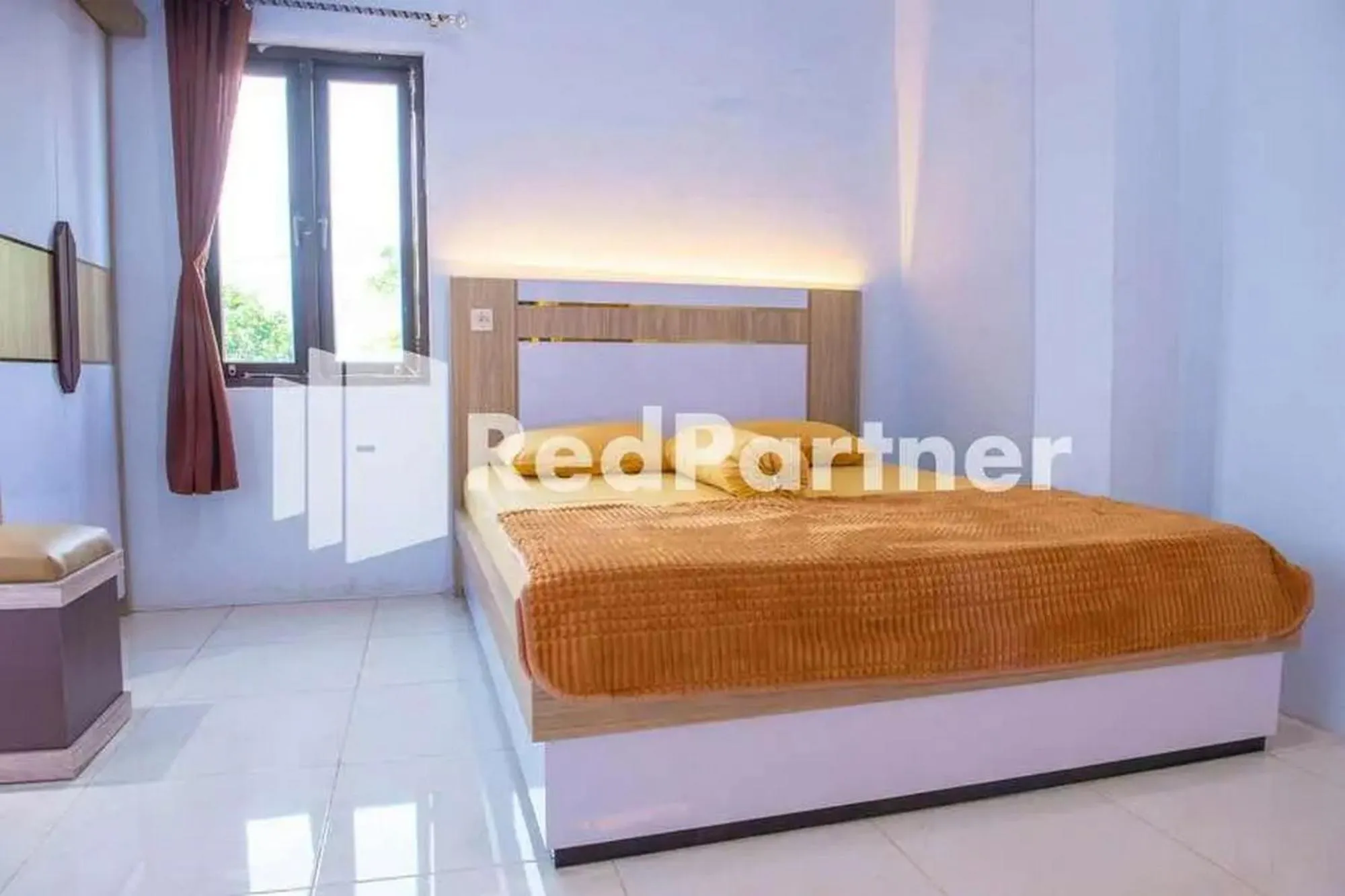 Bed in Hotel Rai's Palopo Exclusive Mitra RedDoorz