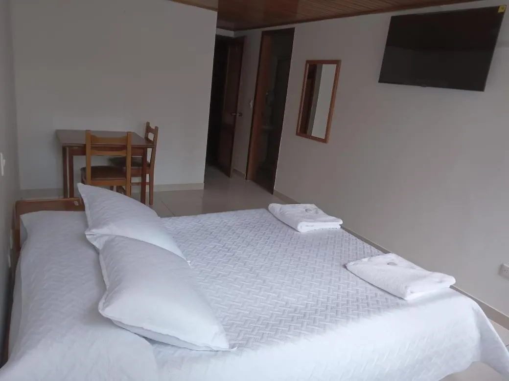 Bed in HOTEL SUAREL CENTER