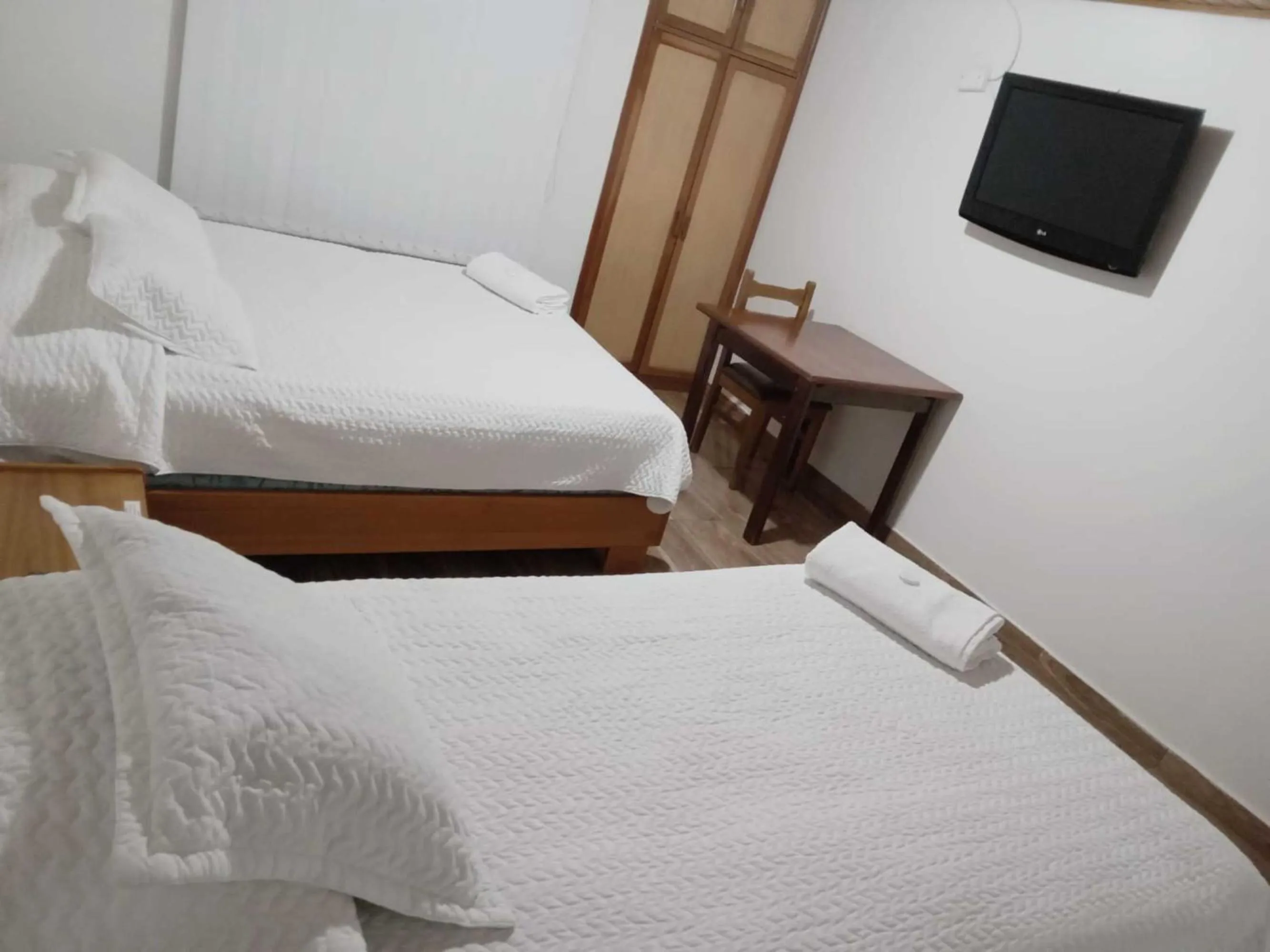 Bed in HOTEL SUAREL CENTER