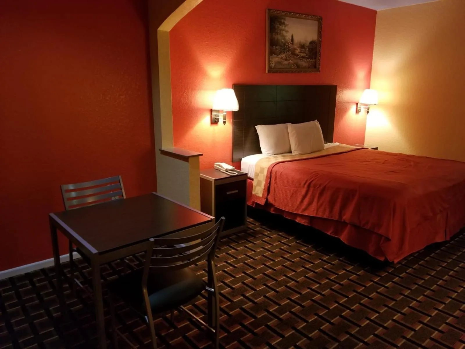 Bed in Texan Inn & Suites