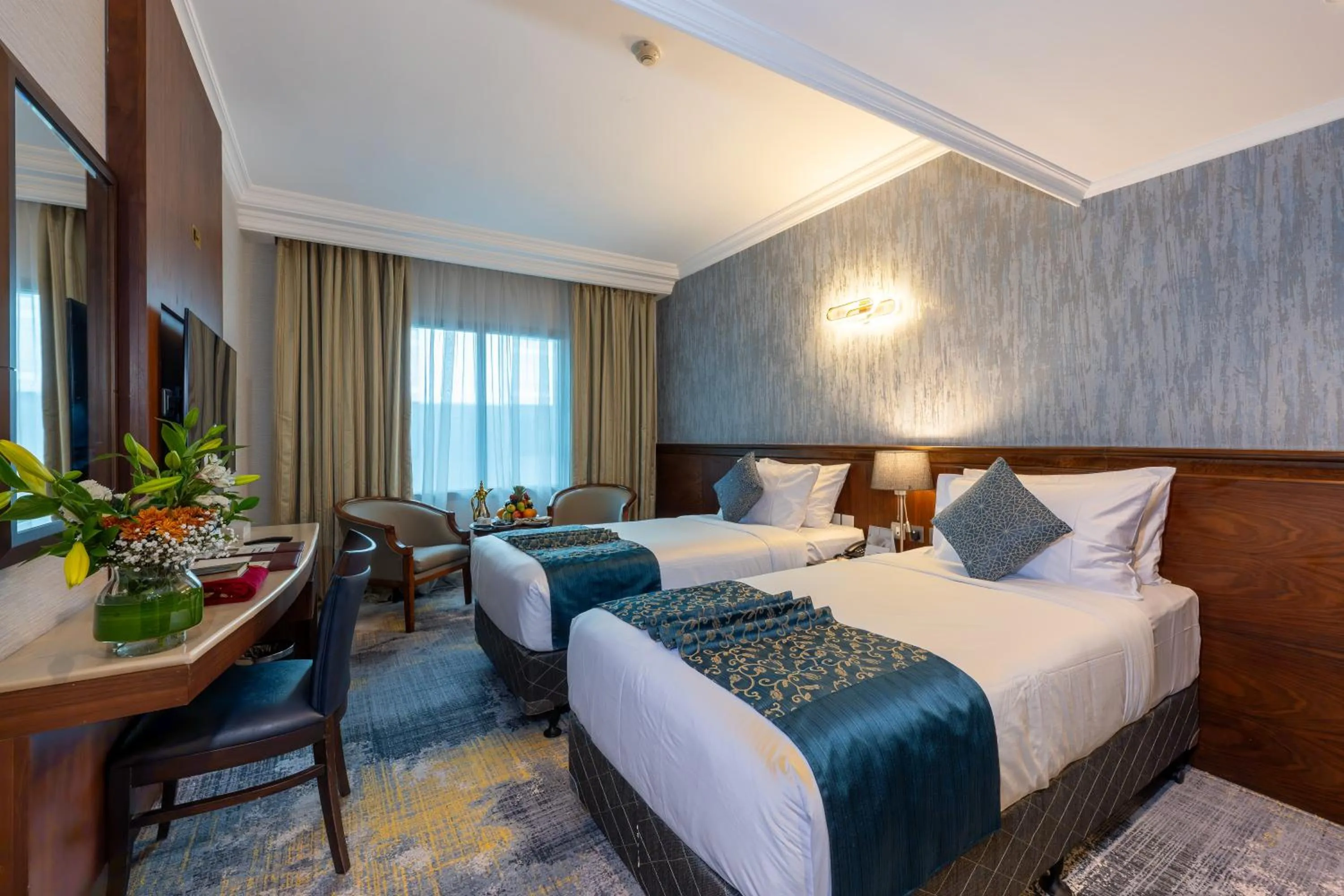 Bed in Nozol Royal Inn Hotel