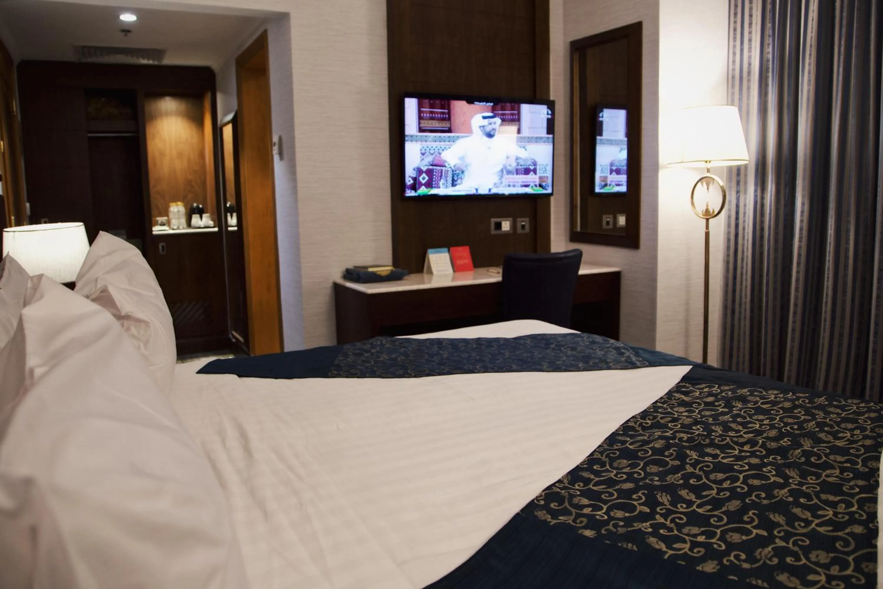 Bed in Nozol Royal Inn Hotel