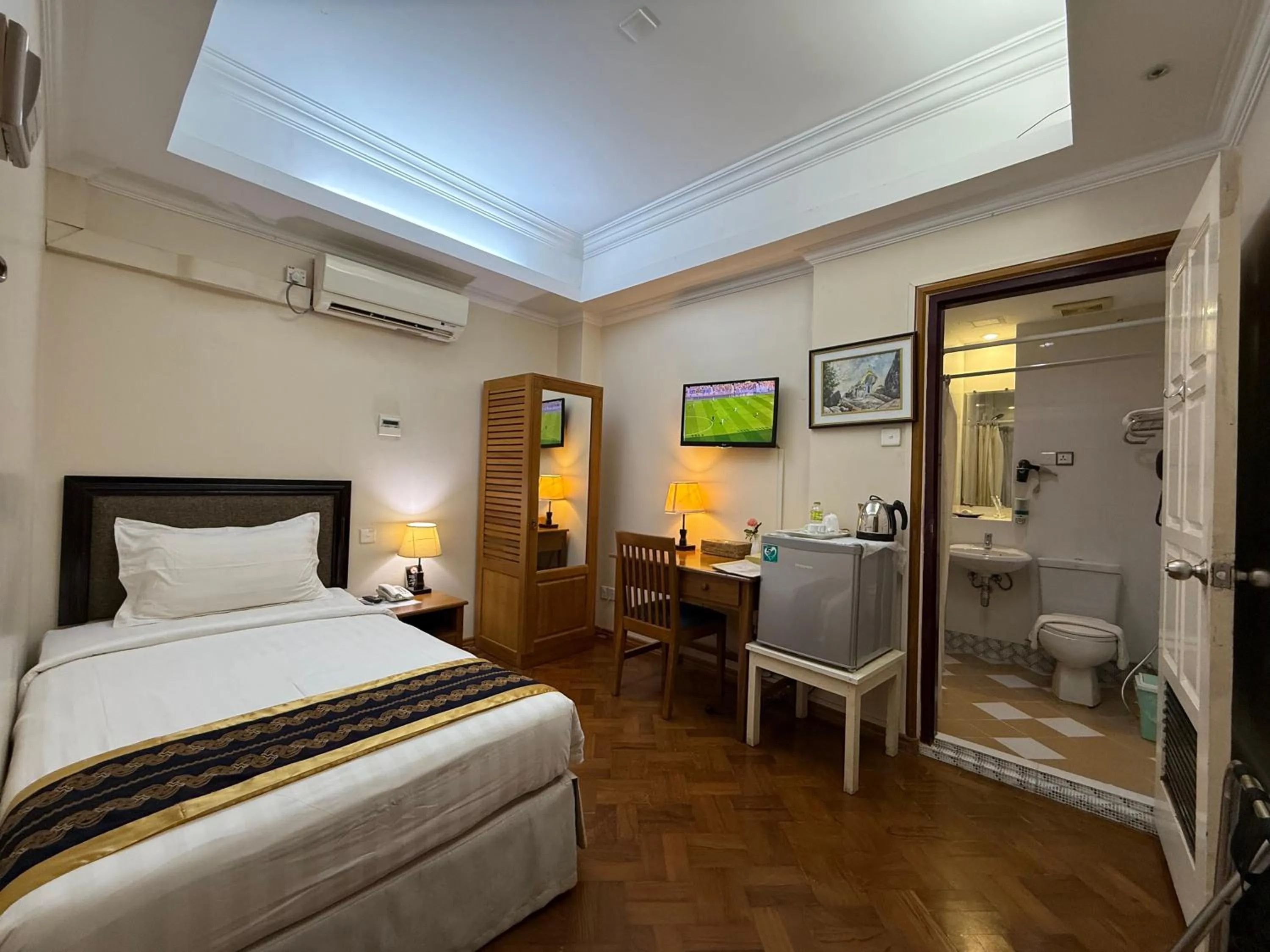 Bed in Grand Laurel Hotel