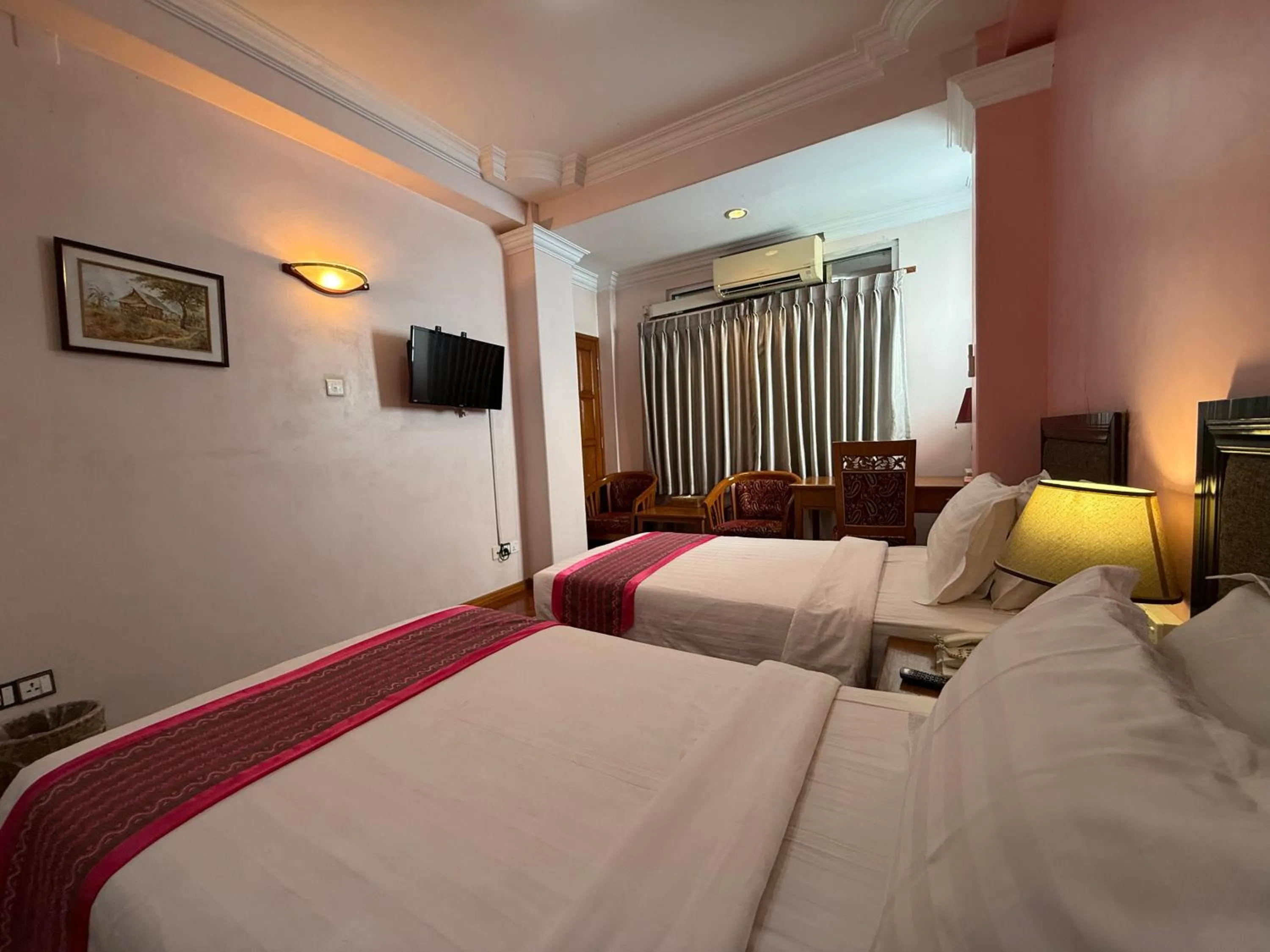 Bed in Grand Laurel Hotel