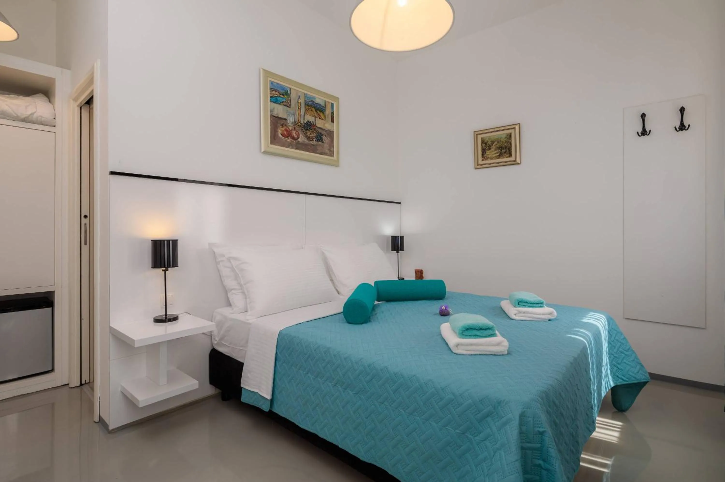 Bed in PLR Luxury Rooms