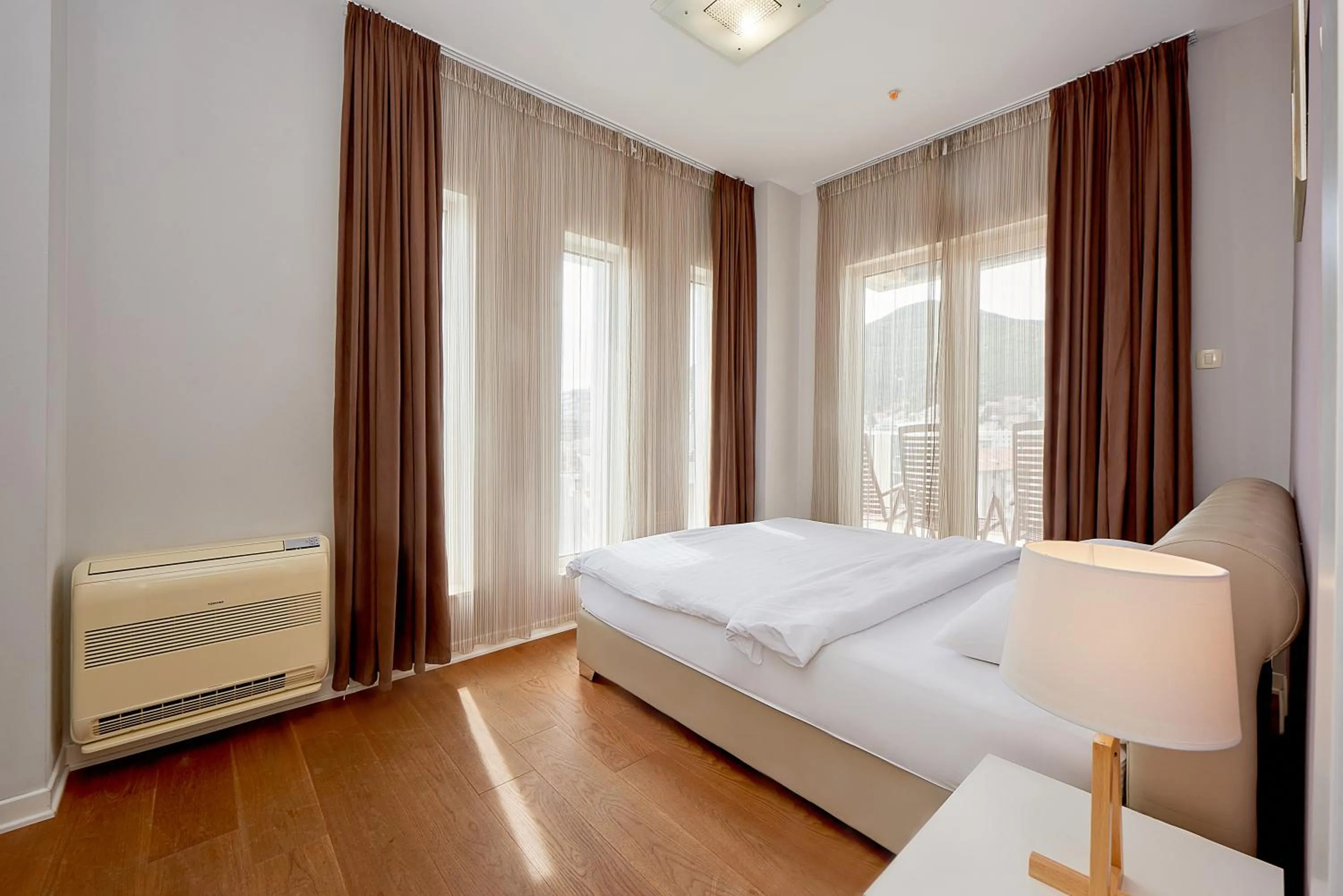 Bedroom in Lux Apartments Sunrior