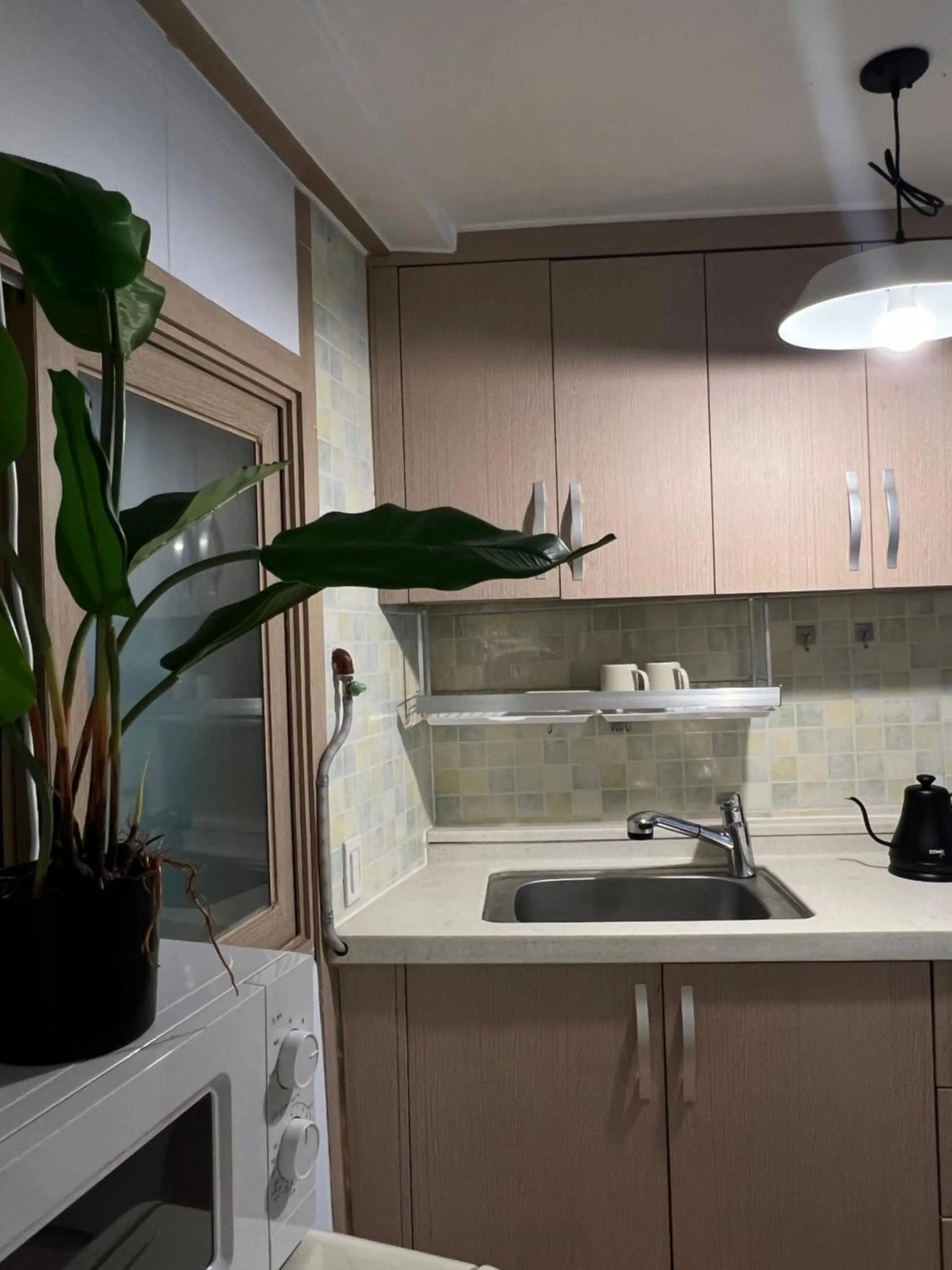 Kitchen or kitchenette in Jnineguesthouse