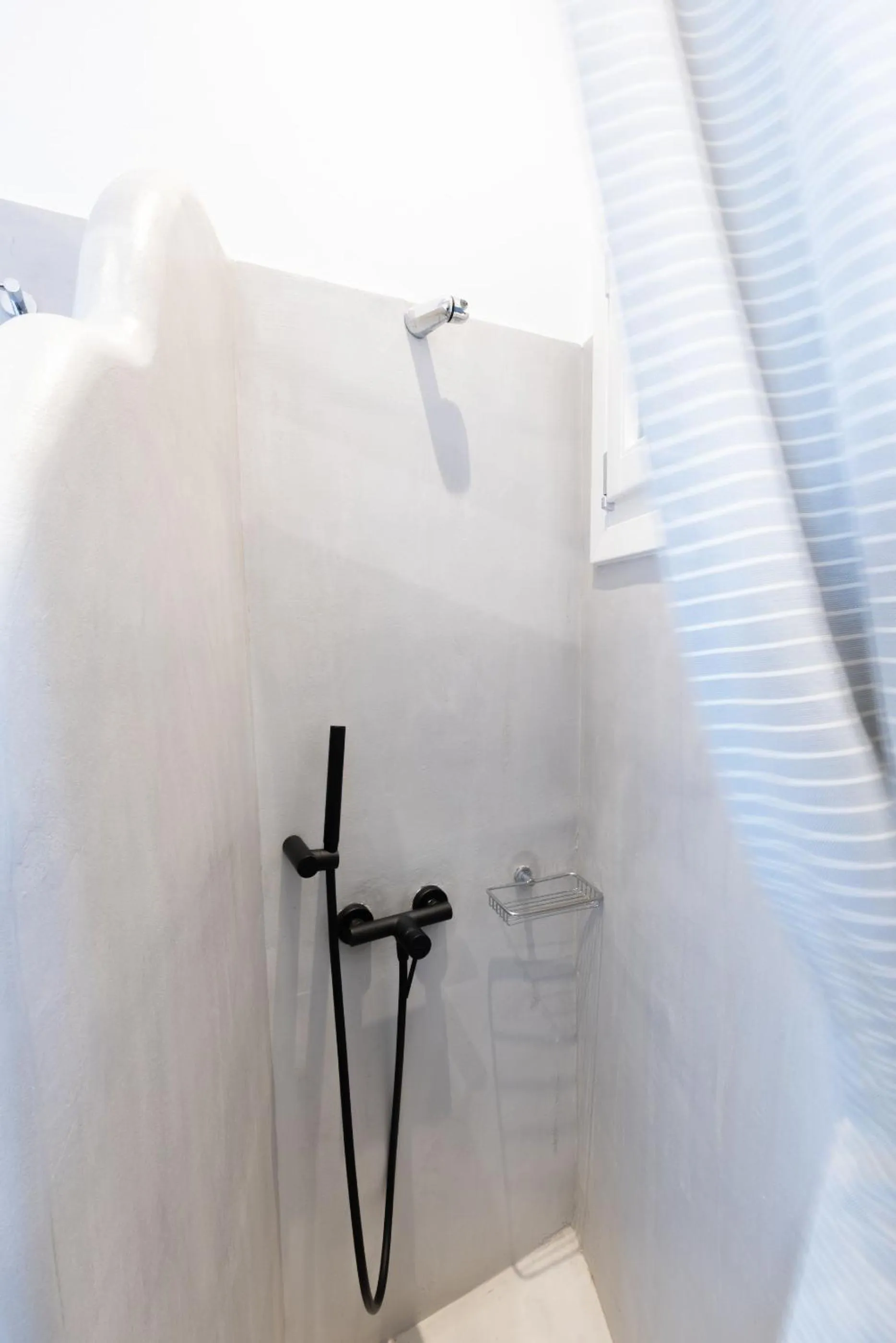 Shower in Parosquare Central Suites