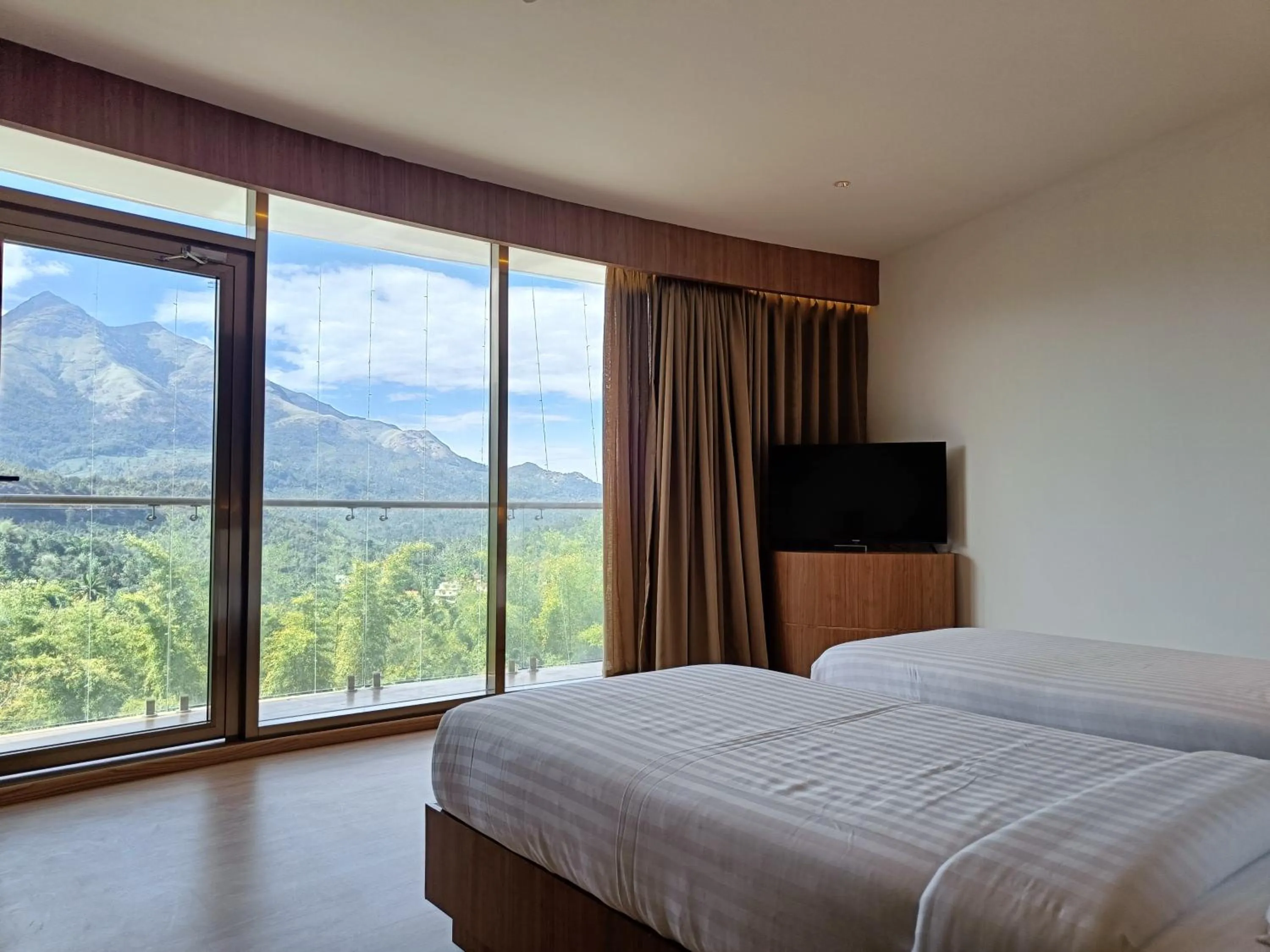 Communal lounge/ TV room, Bed in Hotel Sky Sierra Wayanad