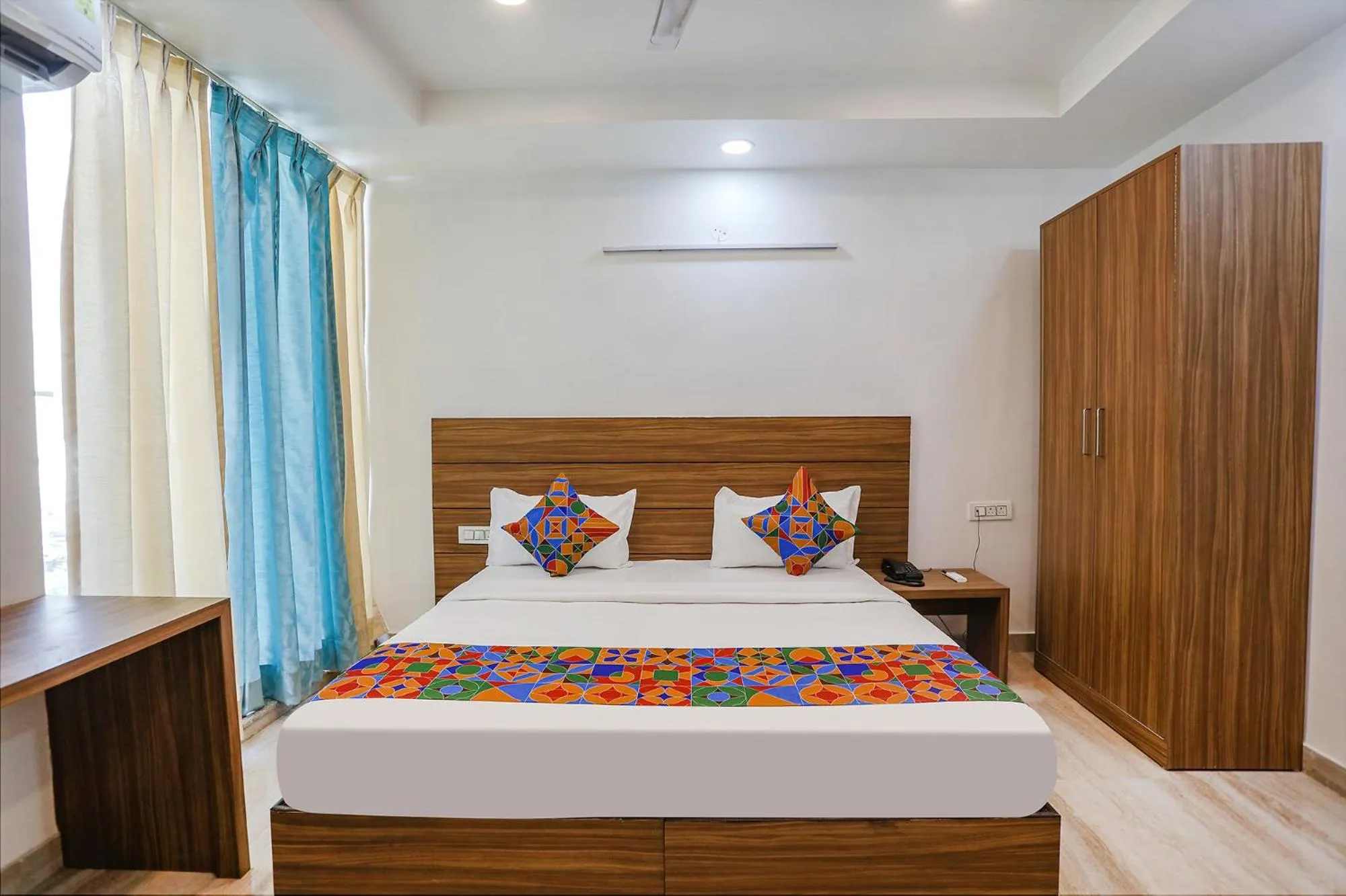 Bed in FabHotel Unique Stay