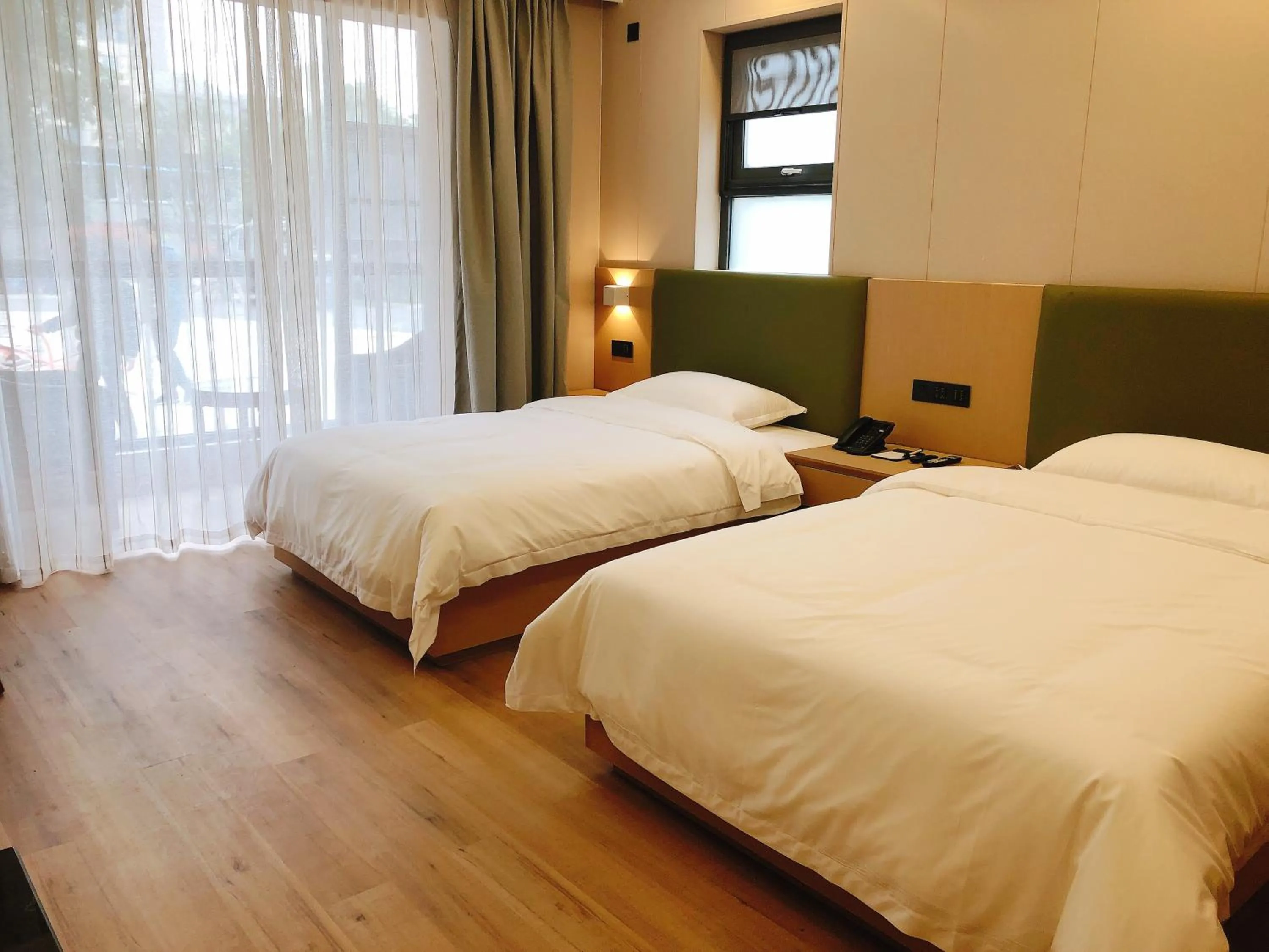 Bed in Jinrui Sunshine Hotel Pengzhou