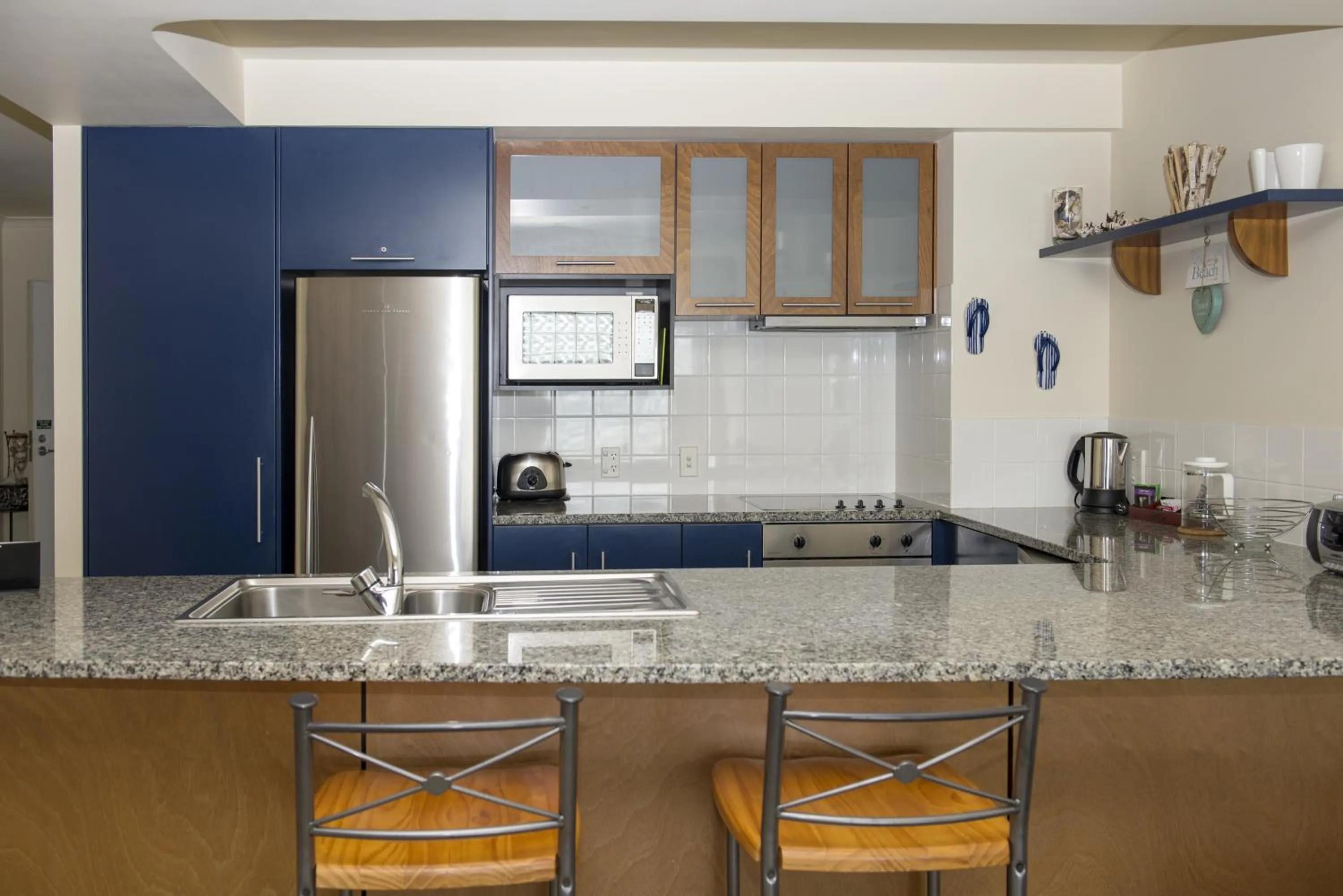 Kitchen or kitchenette in The Reef Beachfront Apartments