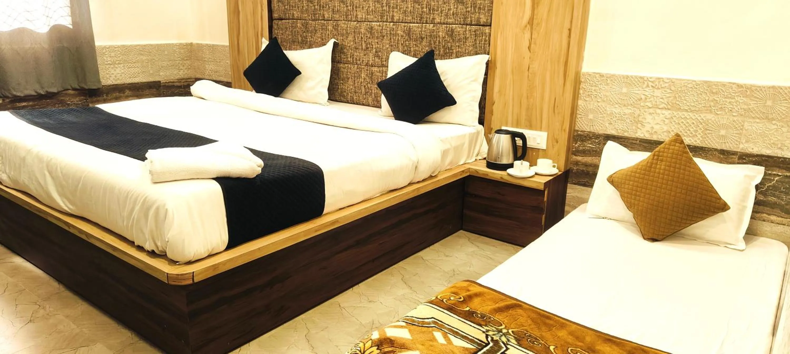 Bedroom in Hotel Grand Vijay