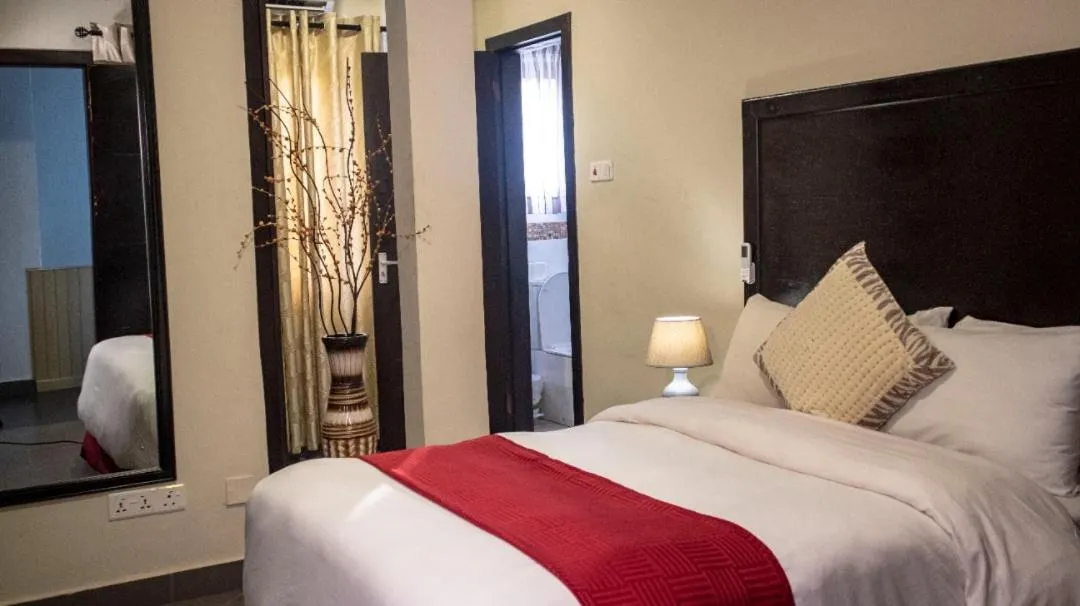 Bed in SSNIT GUEST HOUSE