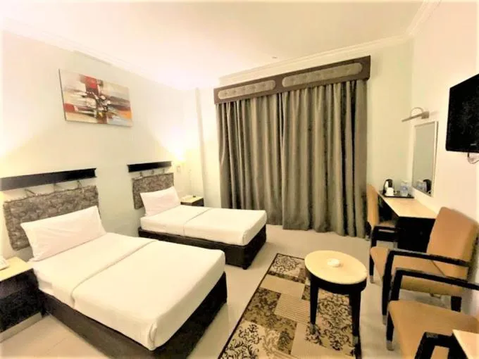 Bed in Signature Inn Hotel Deira