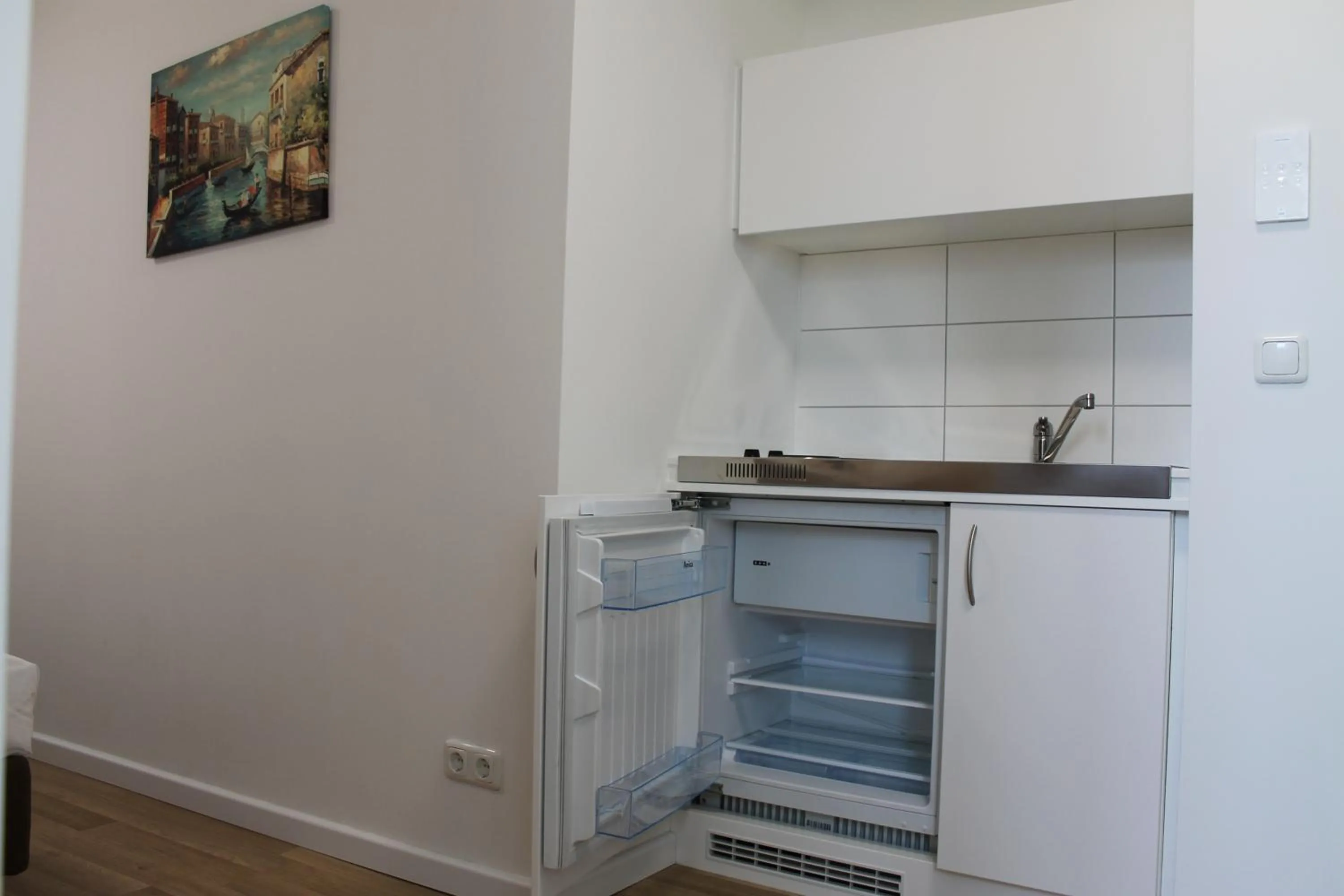 Kitchen or kitchenette in Apartment Hotel am Sand