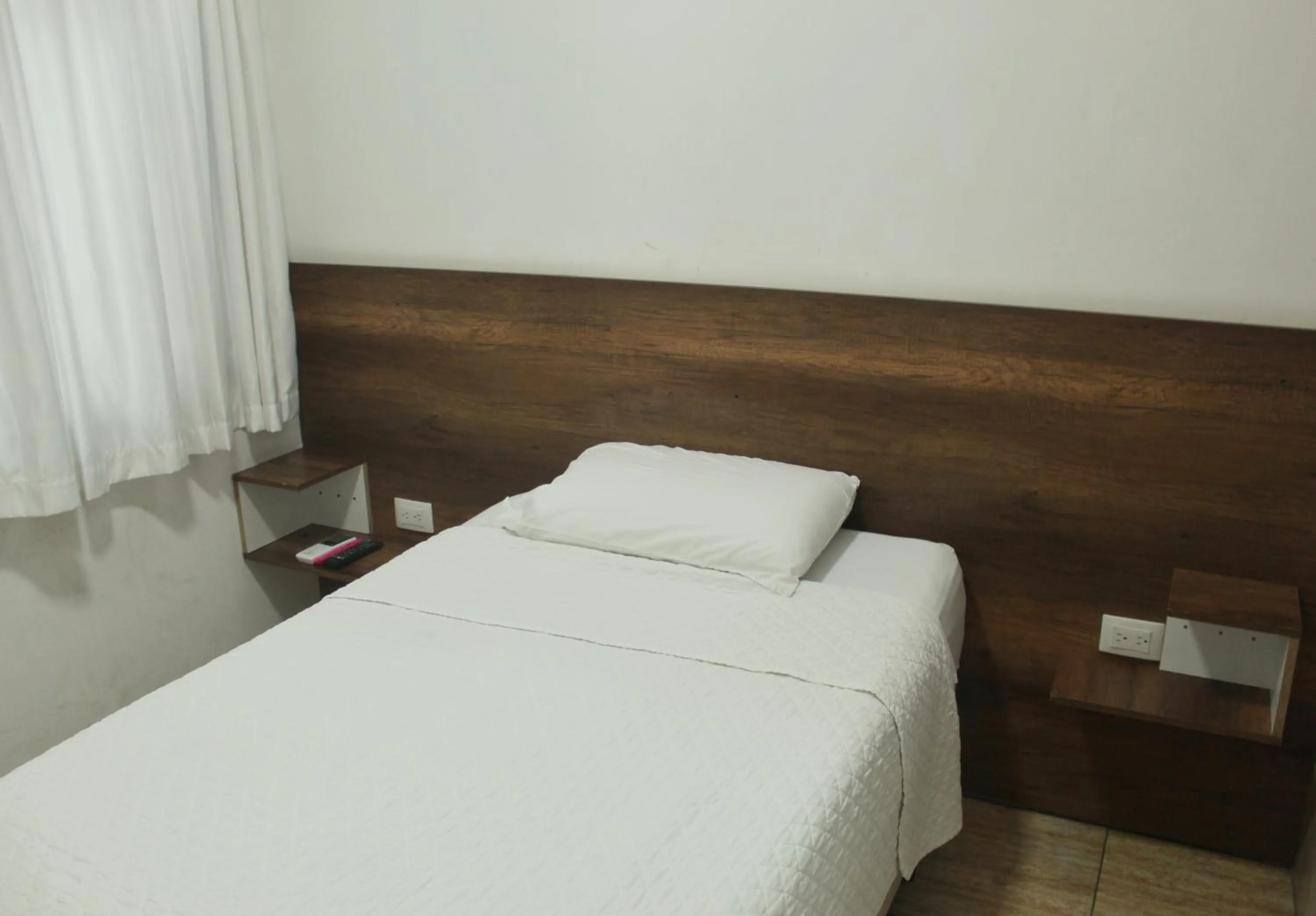 Bed in DC Suites Aeropuerto