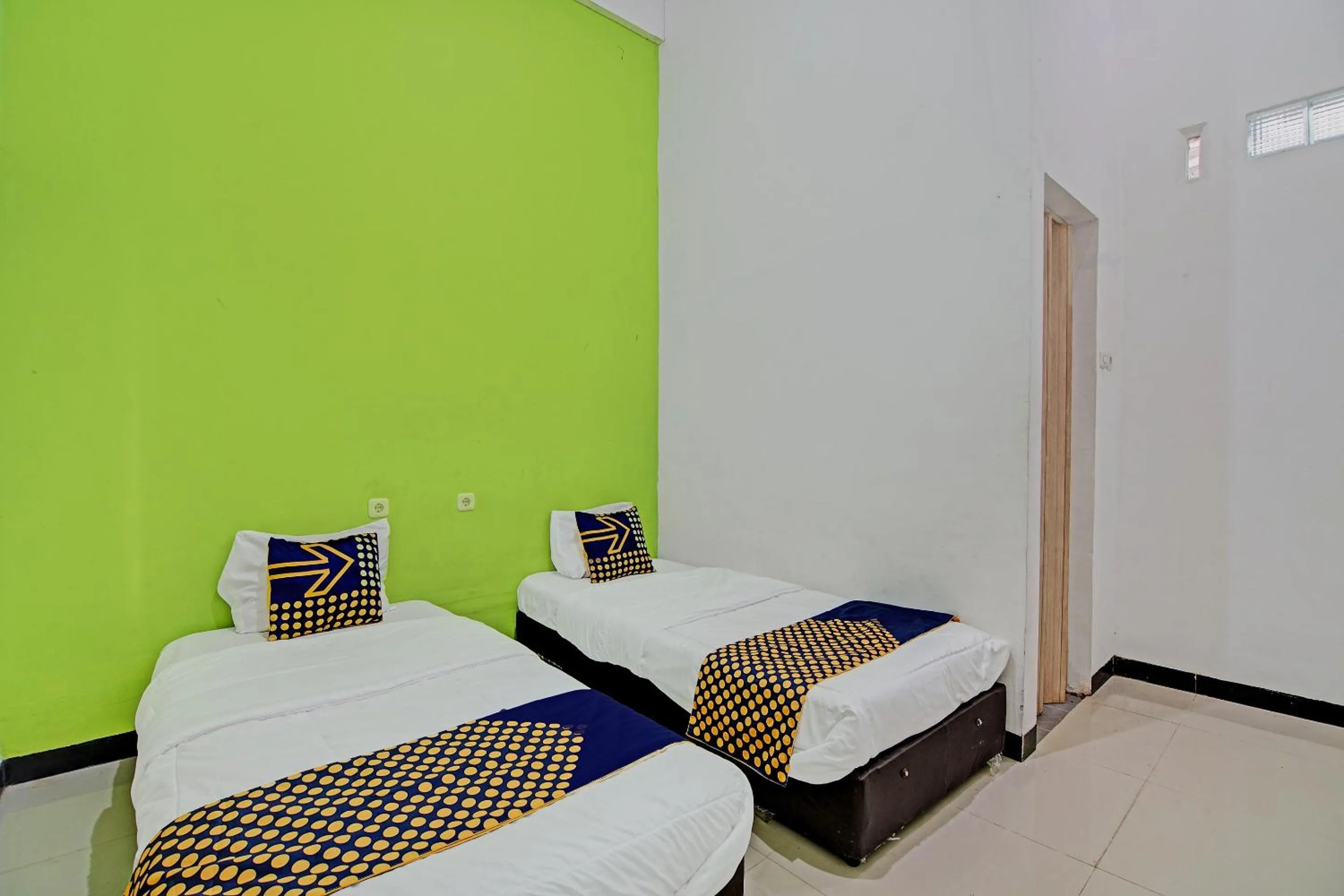 Bedroom, Bed in Hotel O Penginapan Puti SyariahNearBandara Sultan Syarif Kasim II