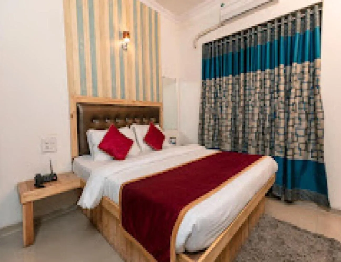 Bed in Orange Inn Hotel