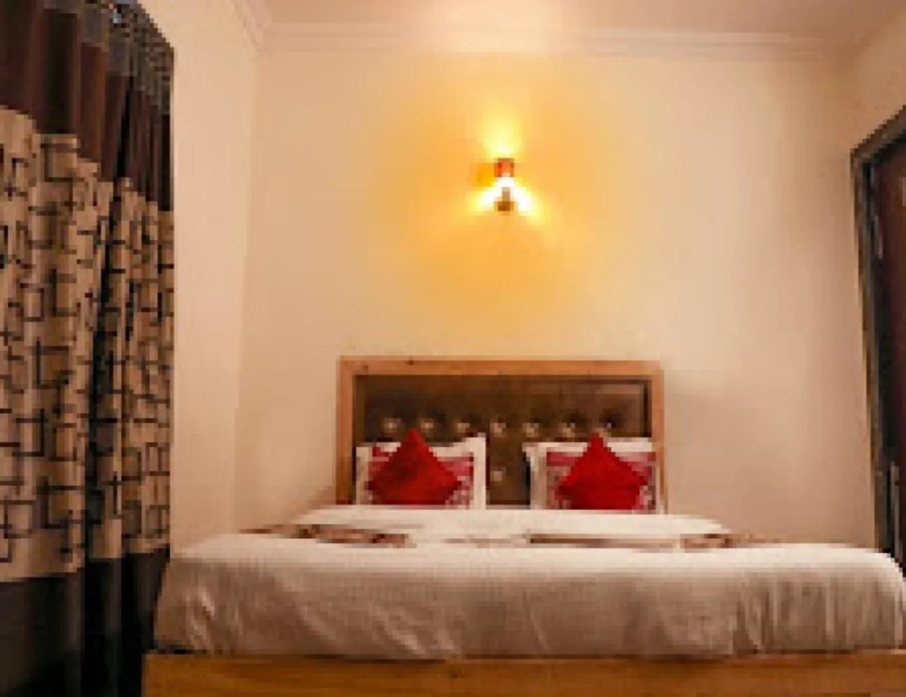 Bed in Orange Inn Hotel